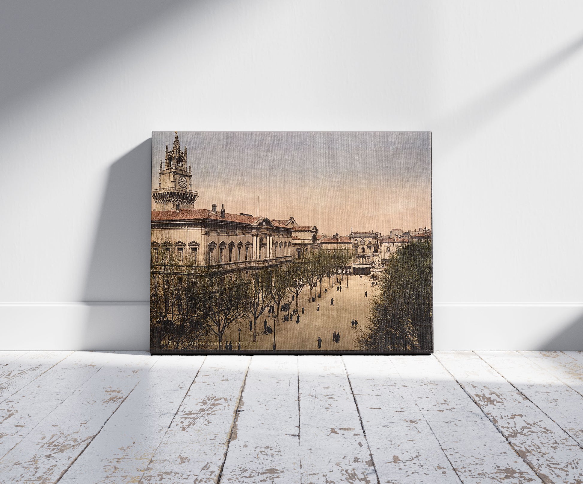 A picture of Hotel de ville place, Avignon, Provence, France, a mockup of the print leaning against a wall