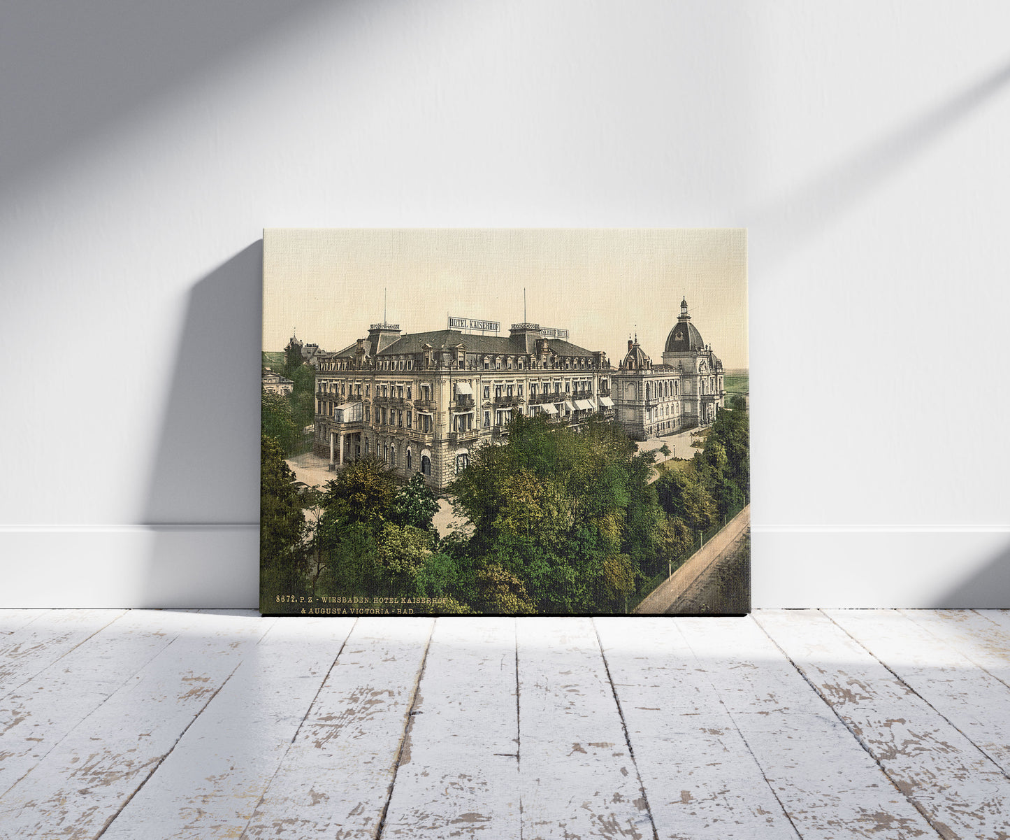 A picture of Hotel Kaiserhof and Augusta Victoria Baths, Wiesbaden, Hesse-Nassau, Germany, a mockup of the print leaning against a wall