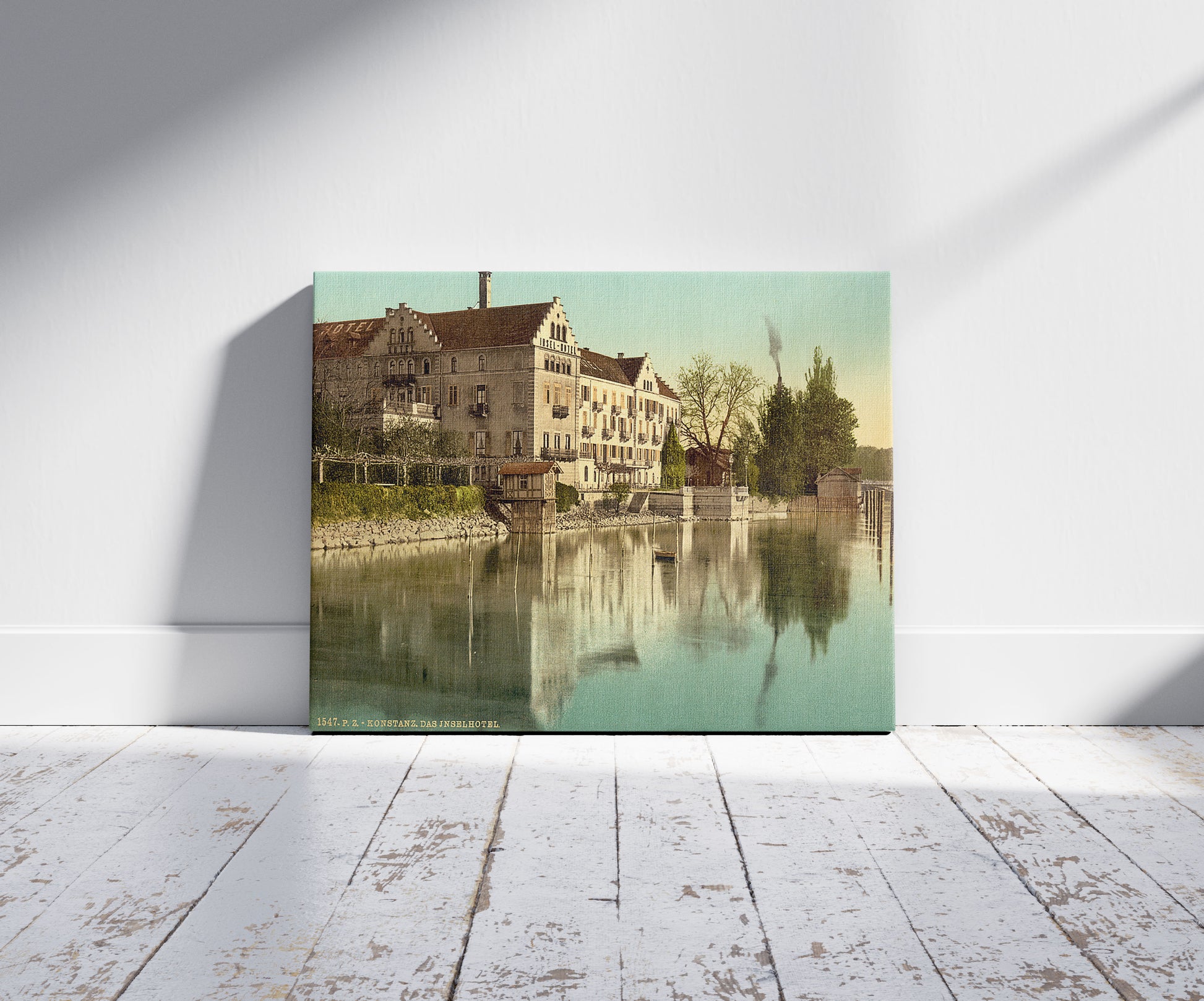 A picture of Insel Hotel, Constance (i.e. Konstanz), Baden, Germany, a mockup of the print leaning against a wall