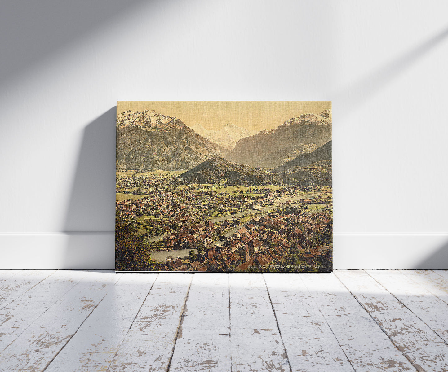 A picture of Interlaken and Unterseen, Bernese Oberland, Switzerland, a mockup of the print leaning against a wall
