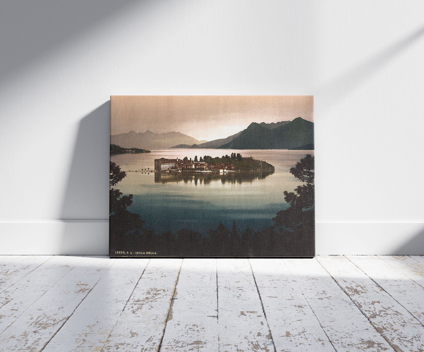 A picture of Isola Bella by moonlight, Lake Maggiore, Italy, a mockup of the print leaning against a wall