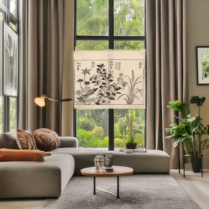 A picture of Japonica, bell flowers, and anemone, a mockup of the print leaning against a wall