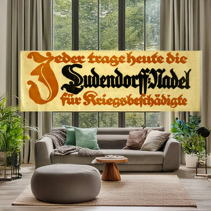 A picture of Jeder trage heute die Ludendorff-Nadel für Kriegsbeschädigte, a mockup of the print leaning against a wall