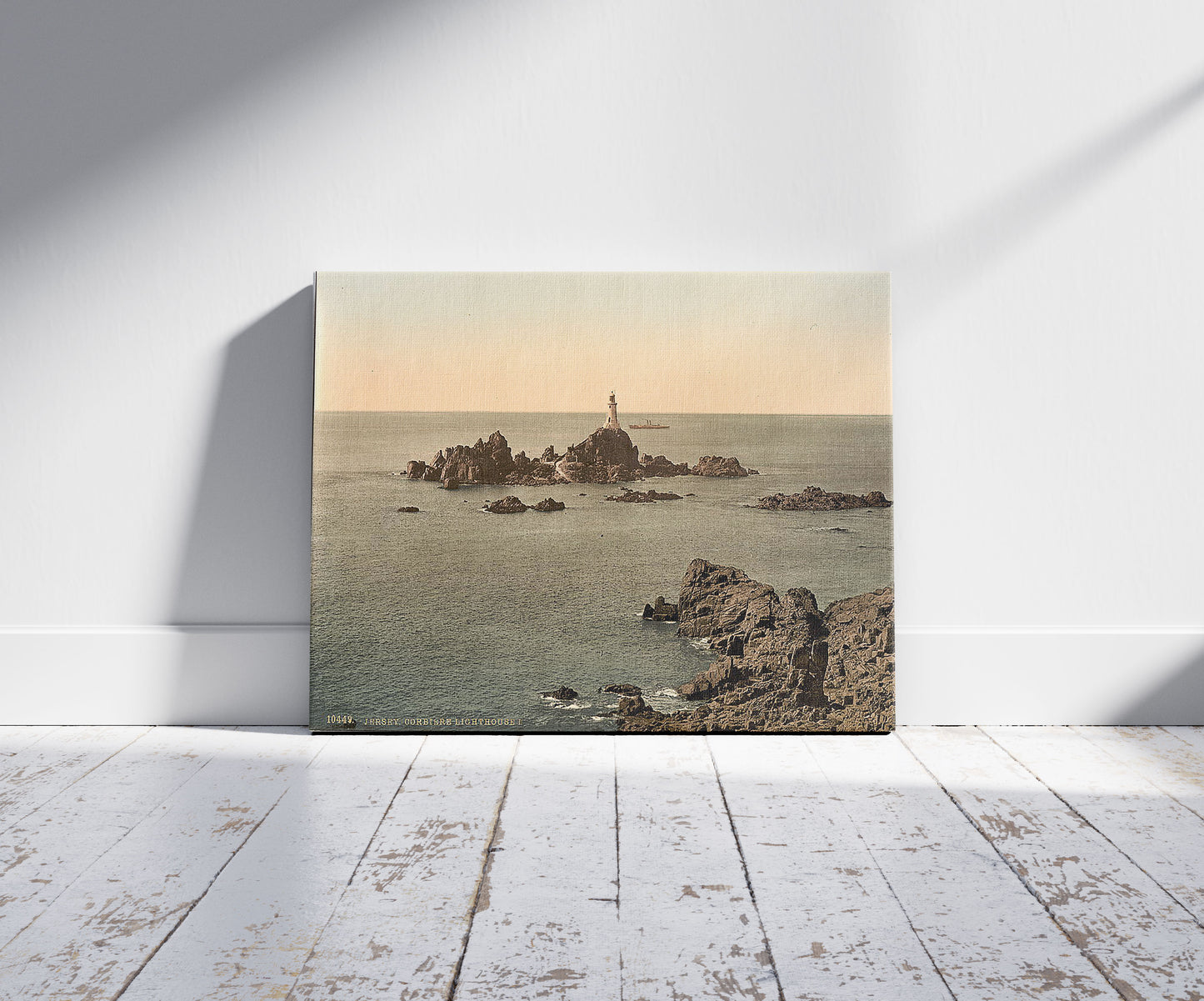 A picture of Jersey, Corbiere Lighthouse, I, Channel Islands, a mockup of the print leaning against a wall