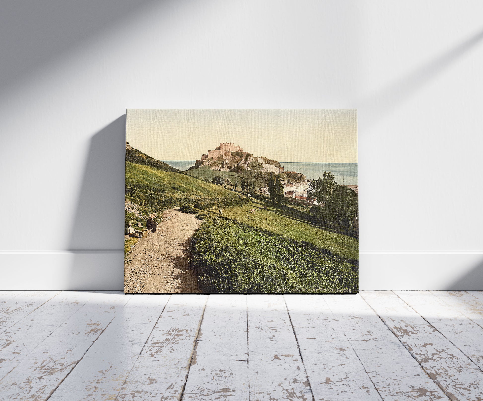 A picture of Jersey, Mont Orgueil Castle, Channel Islands, England, a mockup of the print leaning against a wall