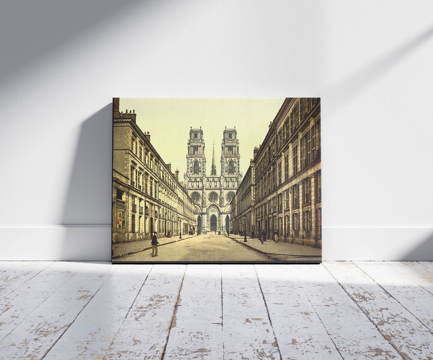 A picture of Joan of Arc Street, Orléans, France, a mockup of the print leaning against a wall