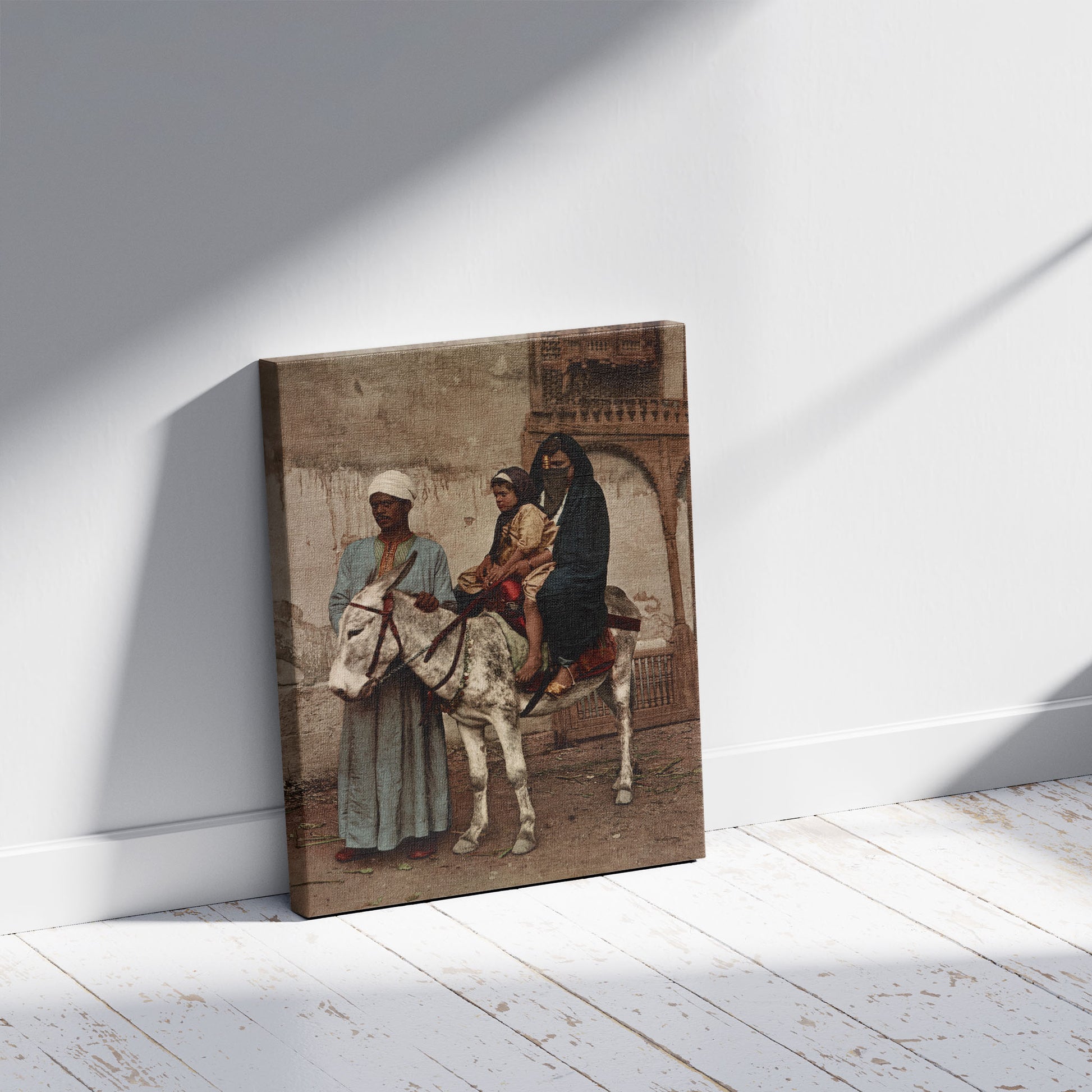 A picture of Kairo. Femme Arabe et son enfant à baudet, a mockup of the print leaning against a wall