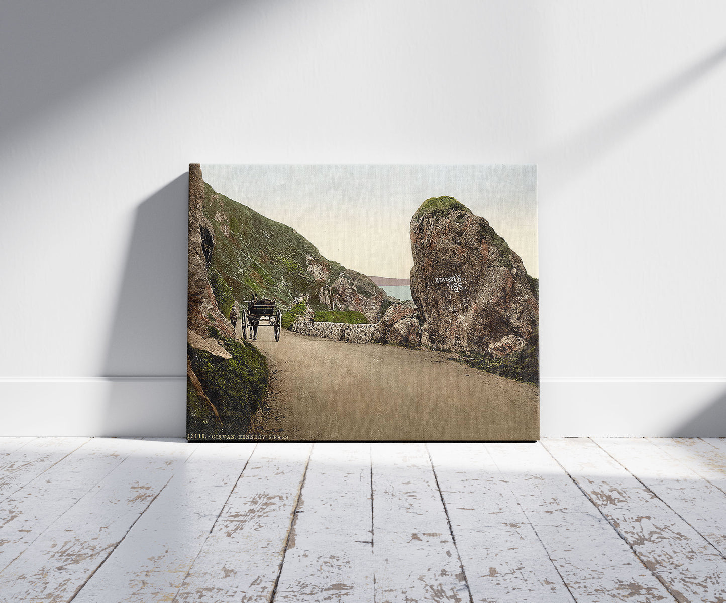 A picture of Kennedy's Pass, Girvan, Scotland, a mockup of the print leaning against a wall