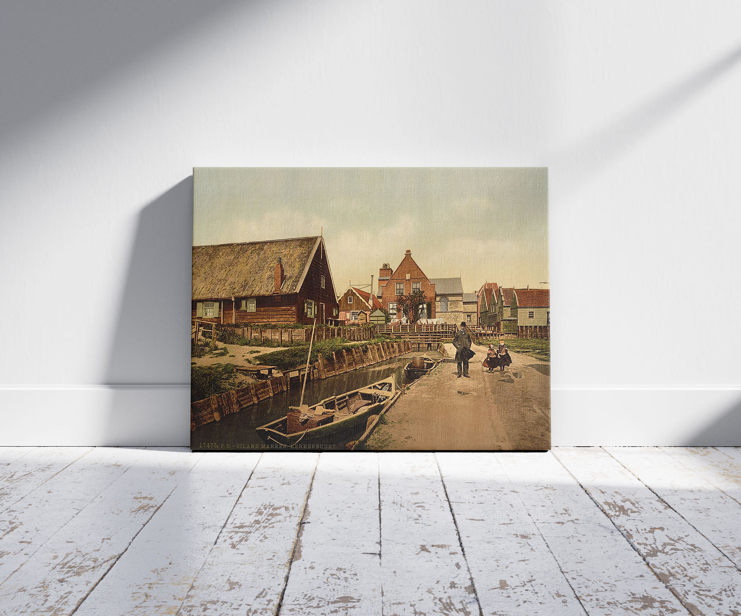 A picture of Kerkenbuurt, near the church, Marken Island, Holland, a mockup of the print leaning against a wall