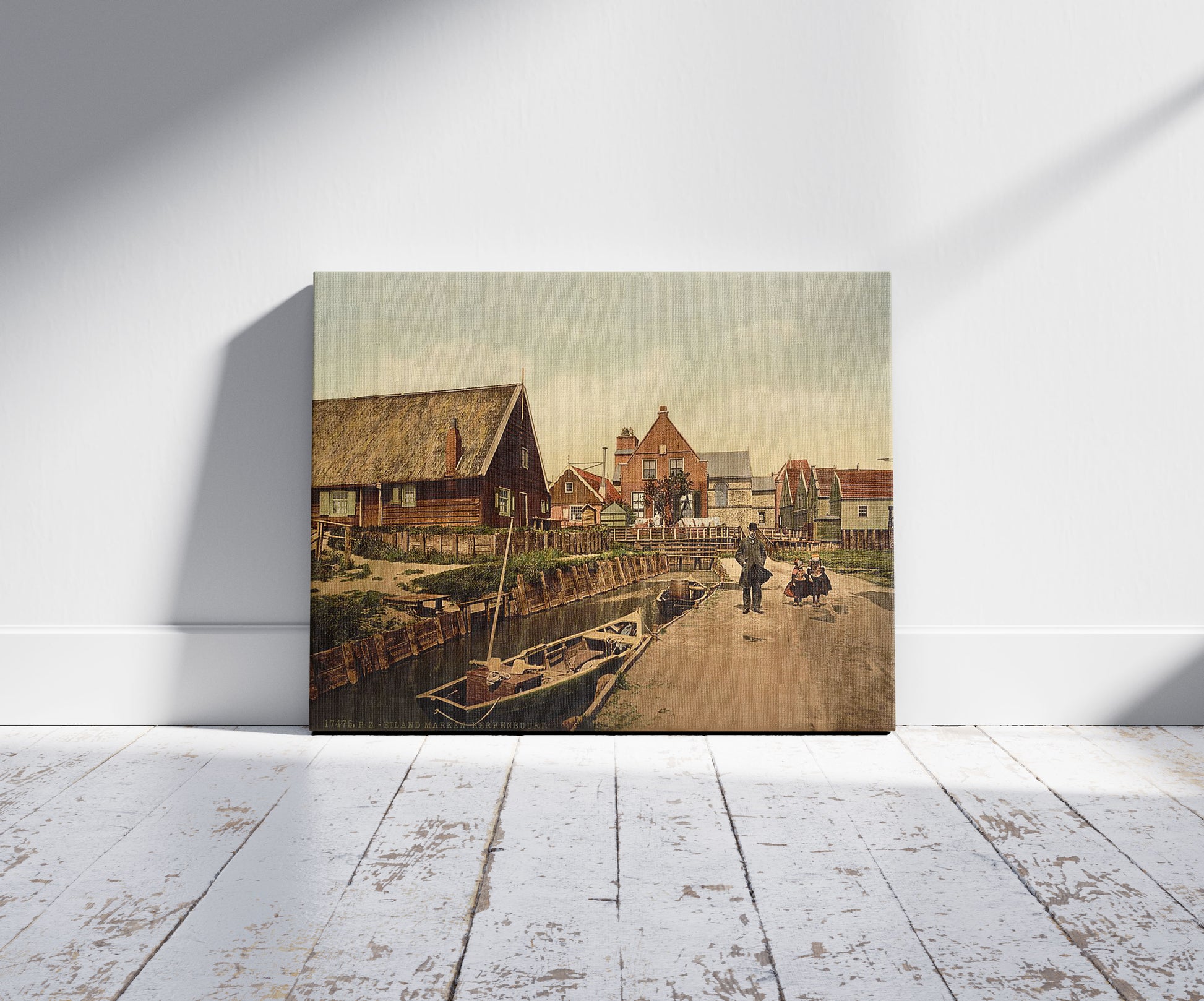 A picture of Kerkenbuurt, near the church, Marken Island, Holland, a mockup of the print leaning against a wall