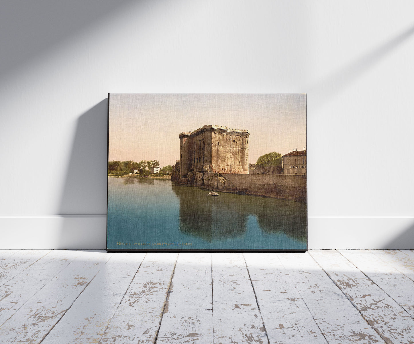 A picture of King René's Castle, Tarascon, Pyrenees, France, a mockup of the print leaning against a wall