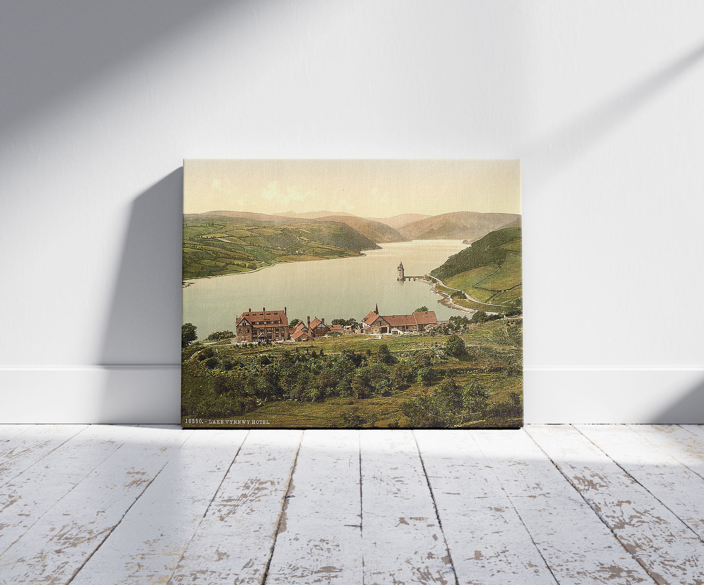 A picture of Lake and hotel, Vyrnwy, Wales, a mockup of the print leaning against a wall