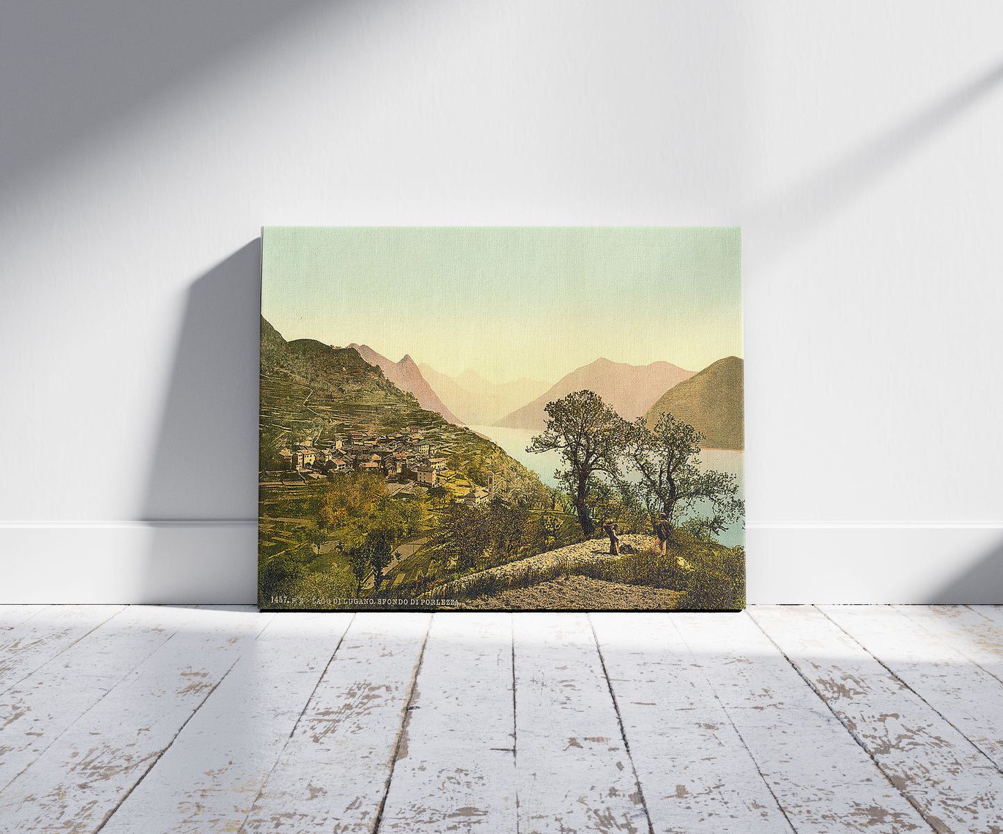 A picture of Lake of Lugano, Porlezza in the background, Tessin, Switzerland, a mockup of the print leaning against a wall