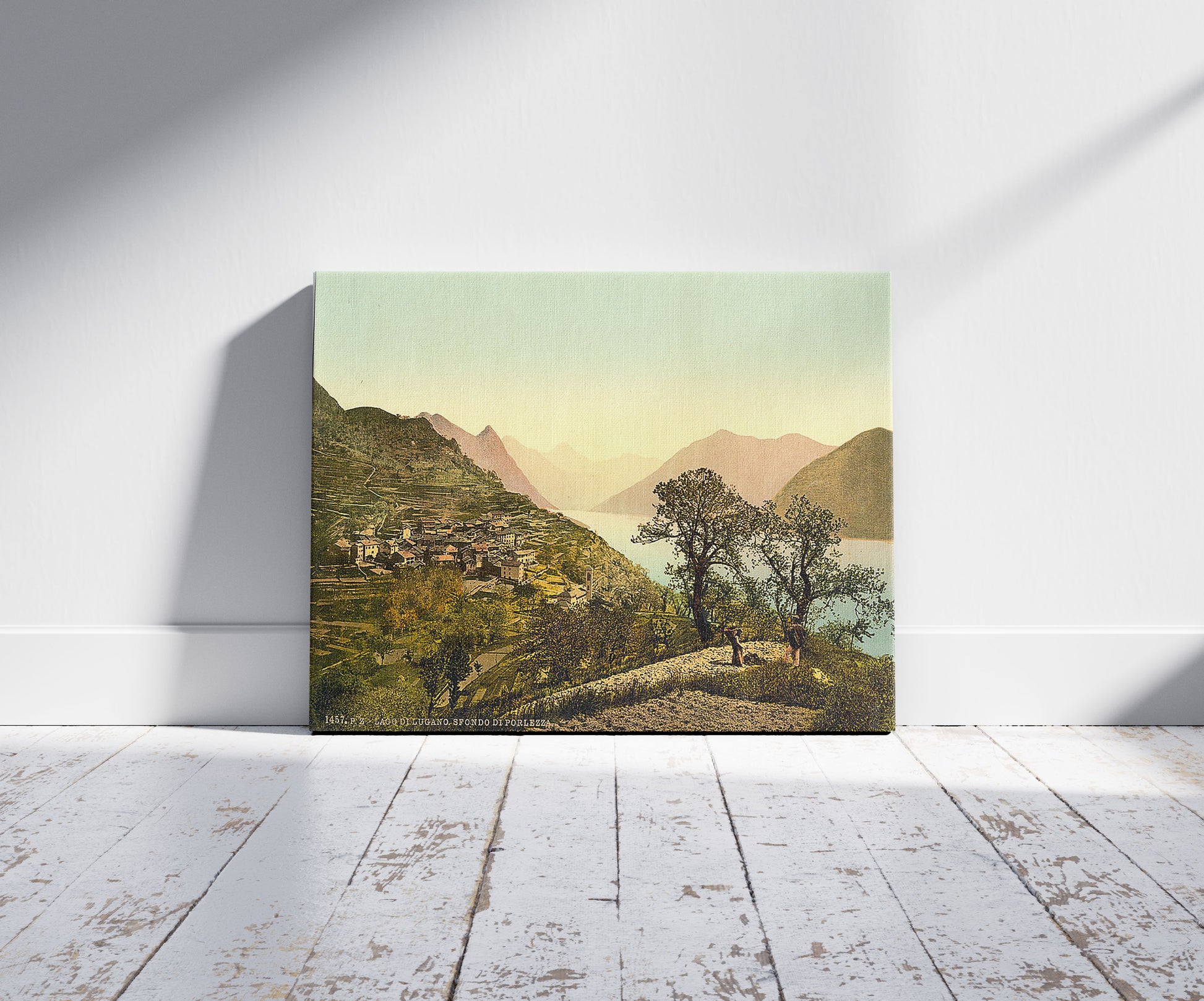 A picture of Lake of Lugano, Porlezza in the background, Tessin, Switzerland, a mockup of the print leaning against a wall