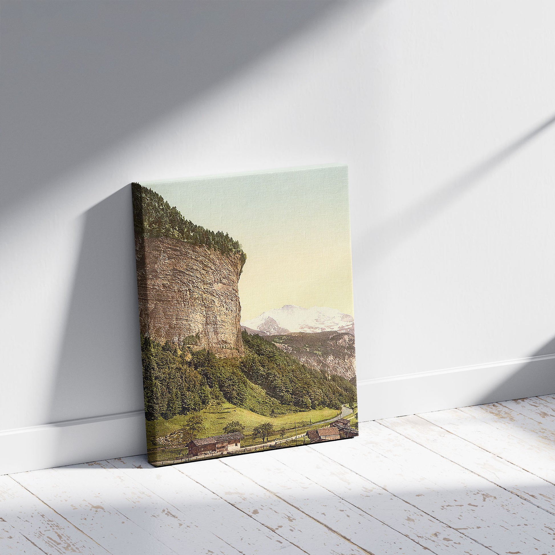 A picture of Lauterbrunnen Valley and Jungfrau, Bernese Oberland, SWitzerland, a mockup of the print leaning against a wall