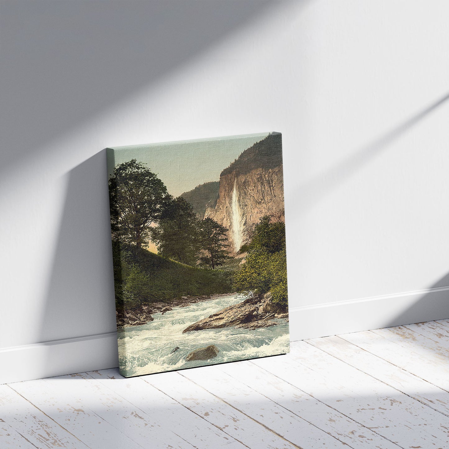 A picture of Lauterbrunnen Valley, Staubbach and White Lutschine, Bernese Oberland, Switzerland, a mockup of the print leaning against a wall