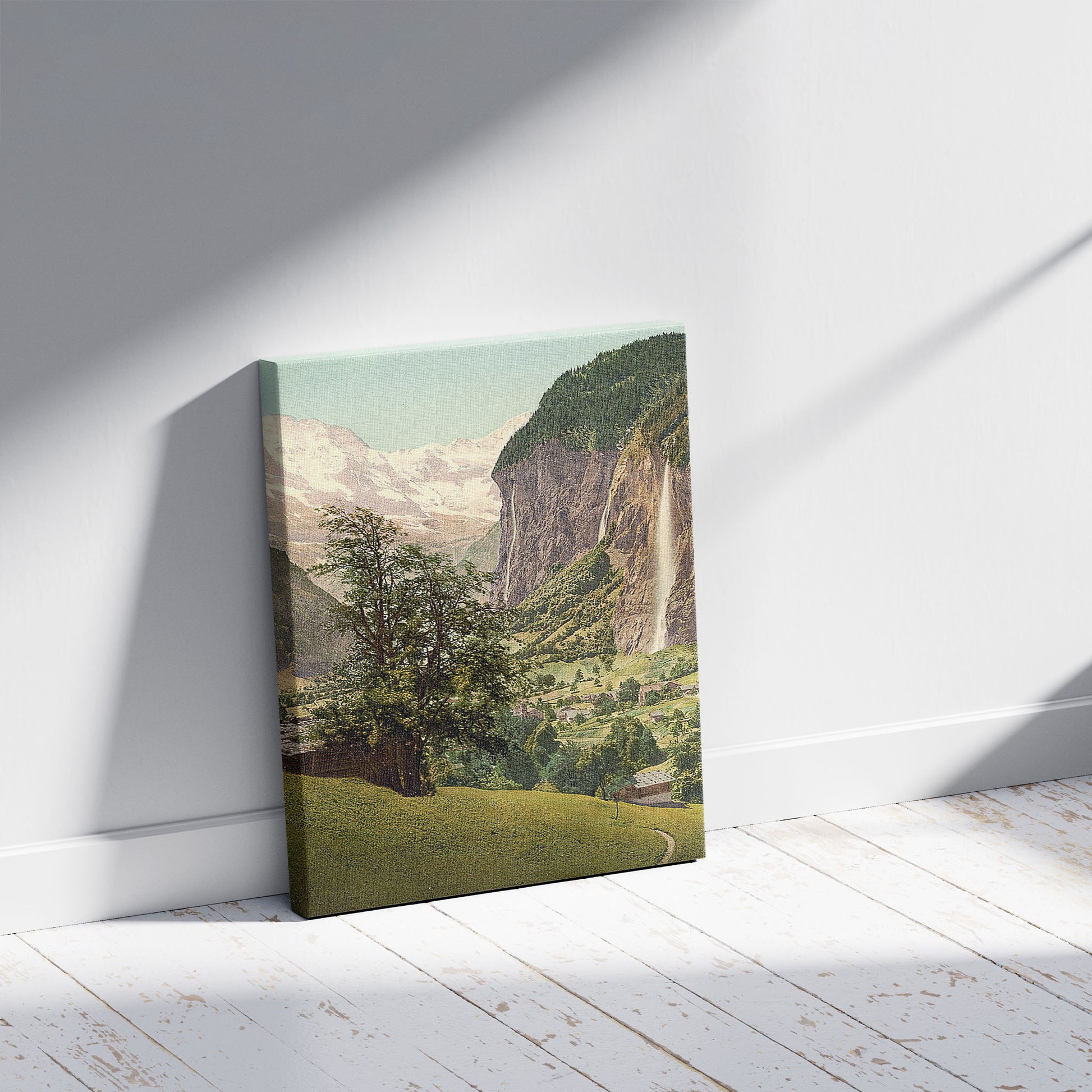 A picture of Lauterbrunnen Valley with Staubbach Waterfall, Bernese Oberland, Switzerland, a mockup of the print leaning against a wall
