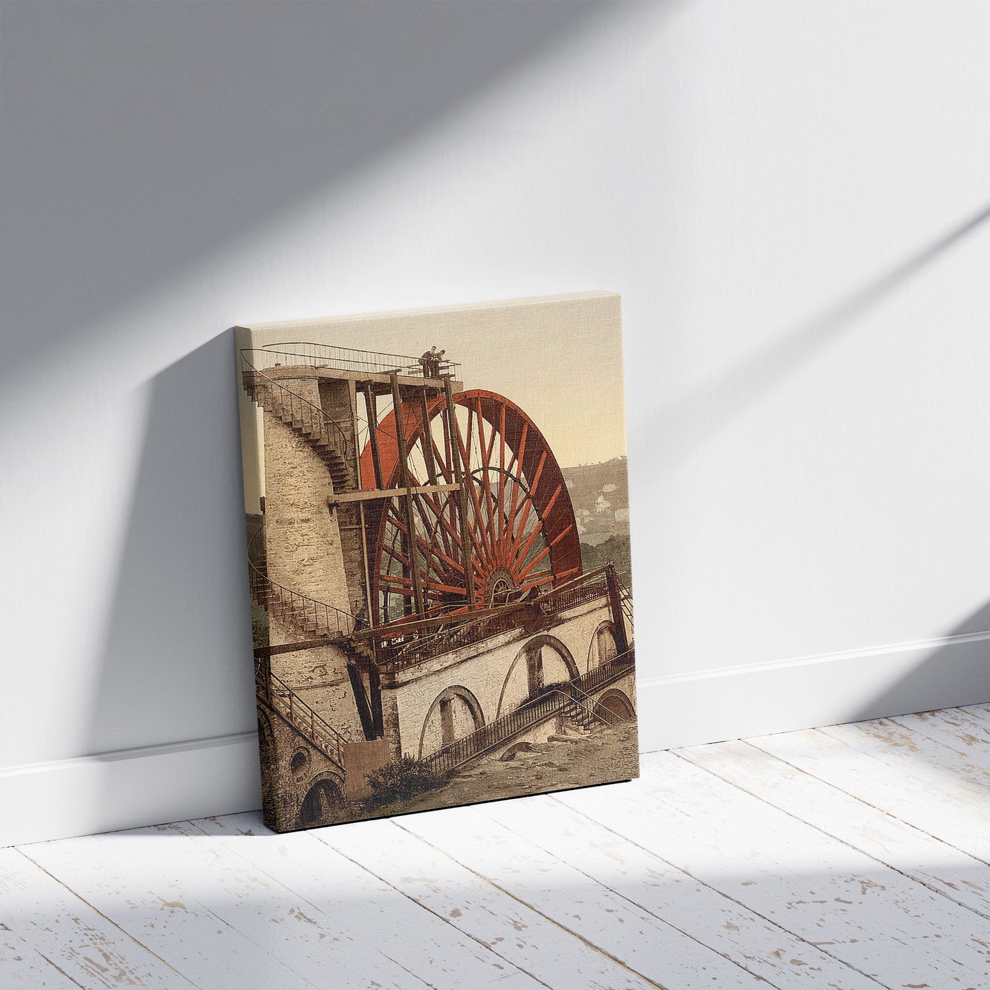 A picture of Laxey, the Wheel, Isle of Man, a mockup of the print leaning against a wall