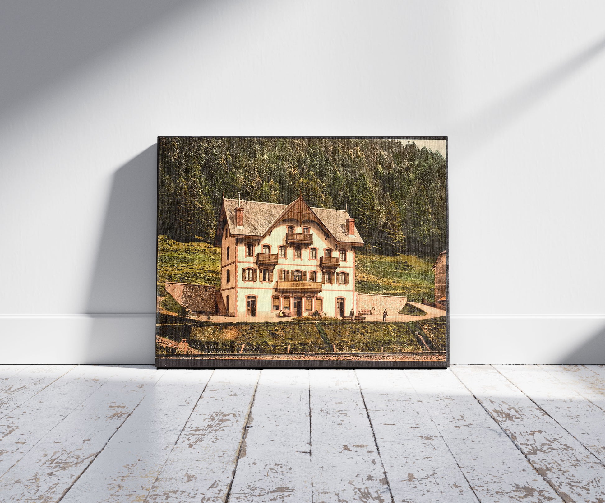 A picture of Le Cantal, le Lioran, Auvergne Mountains, France, a mockup of the print leaning against a wall