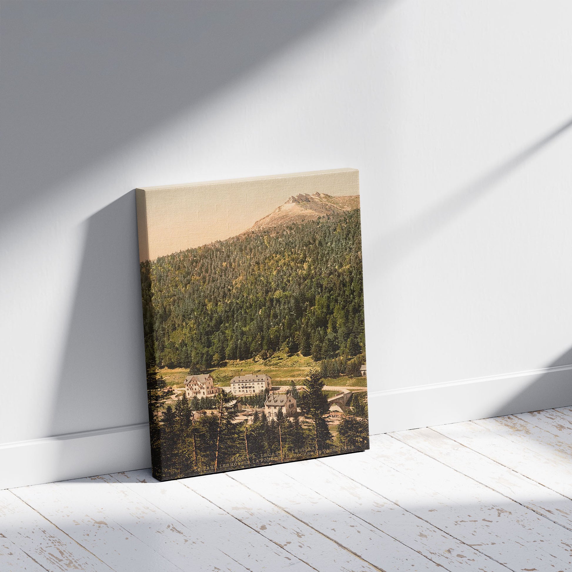 A picture of Le Cantal, le Lioran, hotels, Auvergne Mountains, France, a mockup of the print leaning against a wall