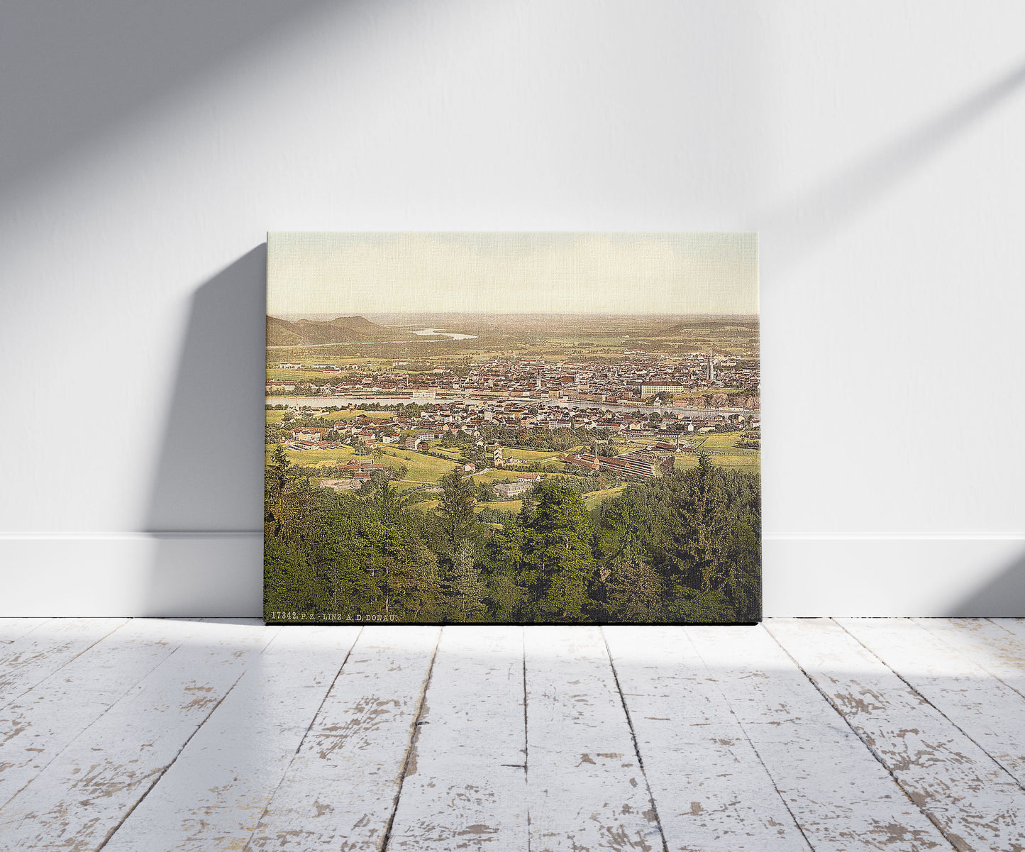 A picture of Lintz (i.e., Linz), general view, Upper Austria, Austro-Hungary, a mockup of the print leaning against a wall