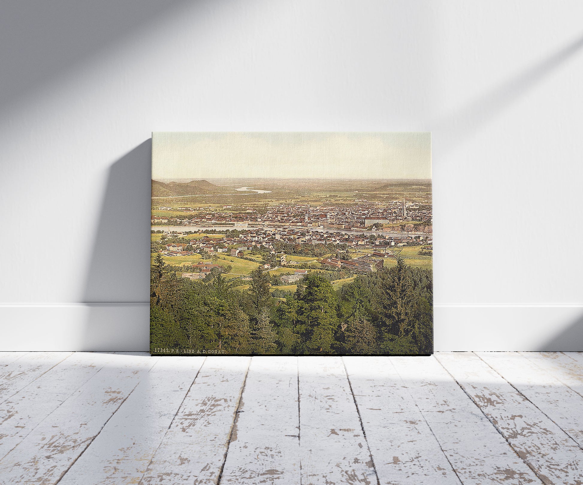 A picture of Lintz (i.e., Linz), general view, Upper Austria, Austro-Hungary, a mockup of the print leaning against a wall
