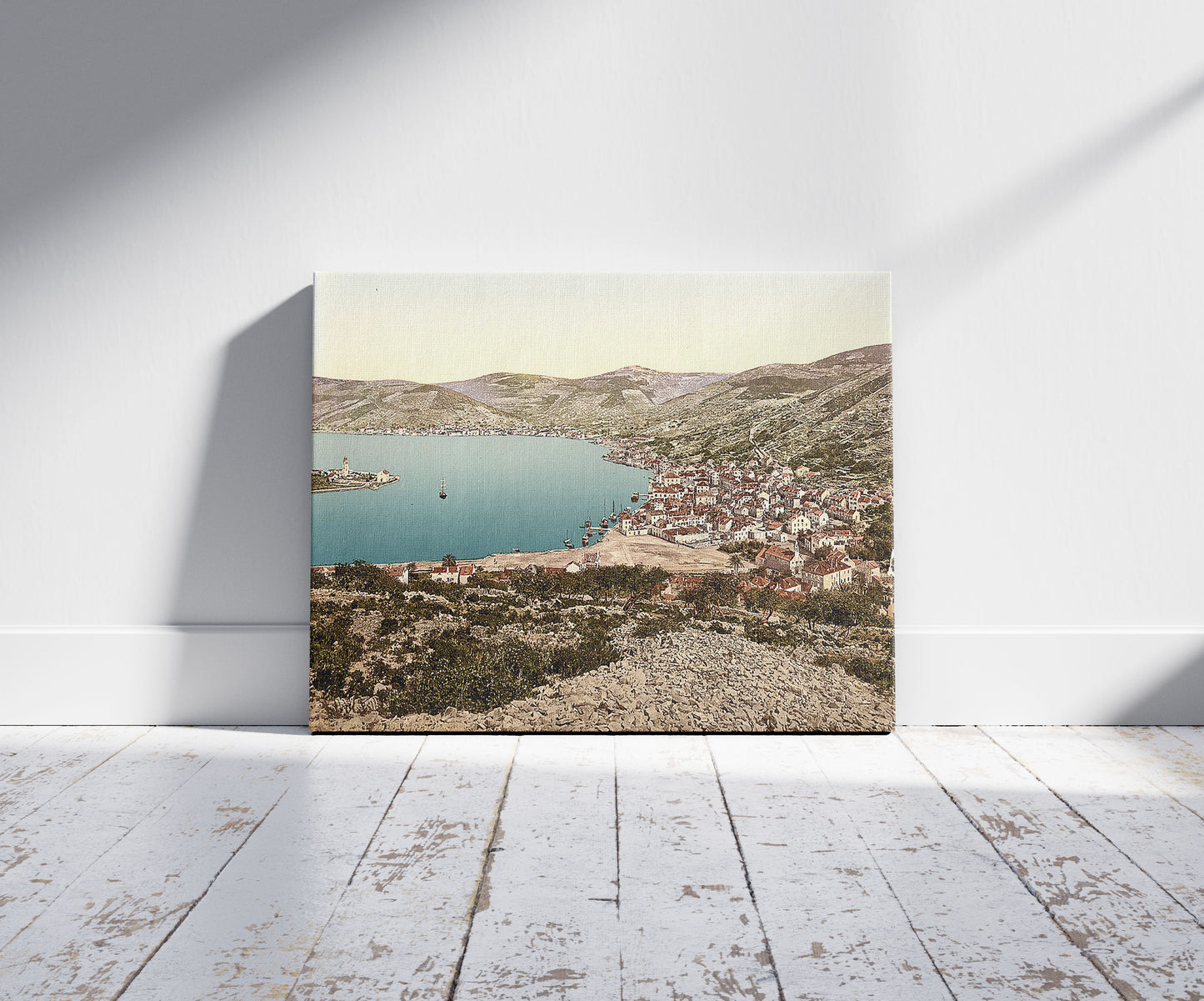 A picture of Lissa, from the west, Dalmatia, Austro-Hungary, a mockup of the print leaning against a wall