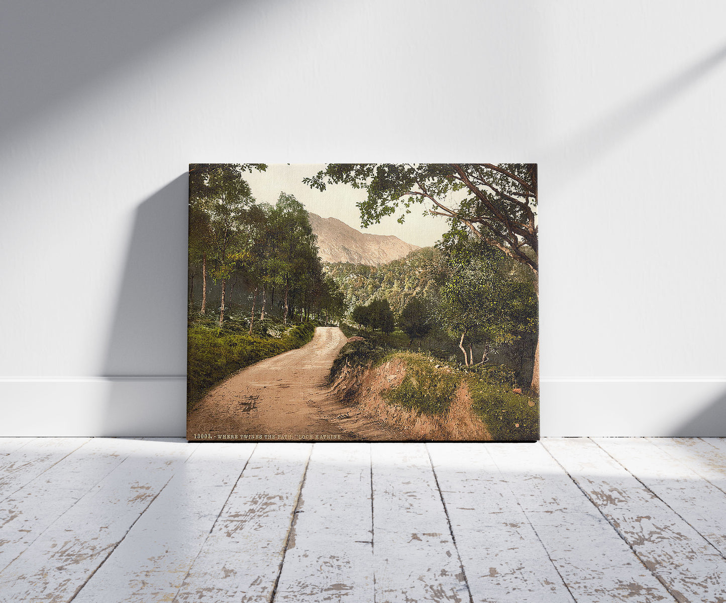 A picture of Loch Katrine "Where Twines the Path," Trossachs, Scotland, a mockup of the print leaning against a wall