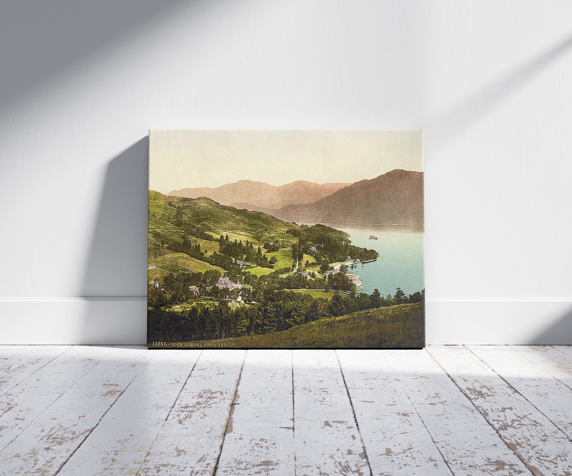 A picture of Loch Lomond from Tarbet, Scotland, a mockup of the print leaning against a wall