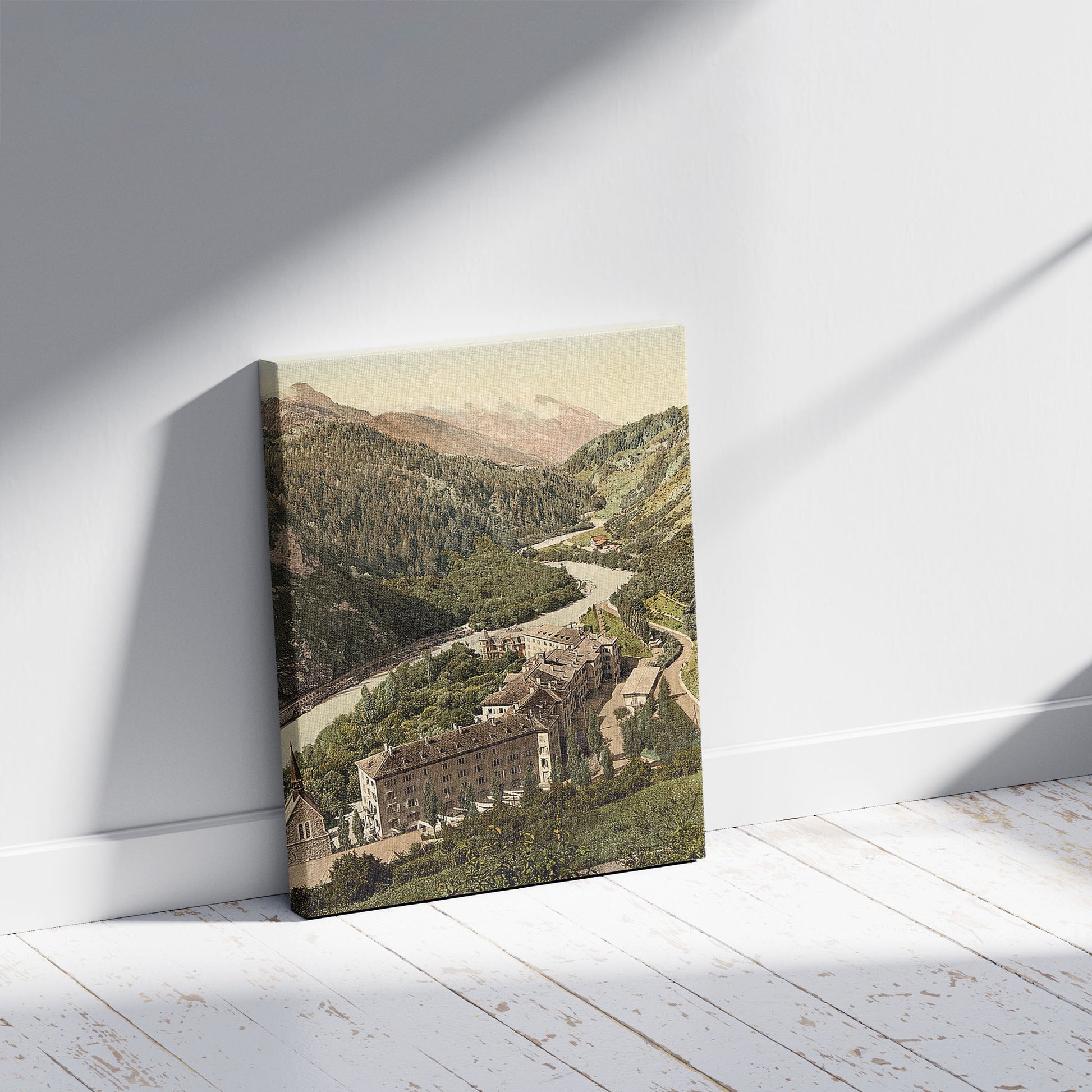 A picture of Lower Engadine, Tarasp, Kurhaus and church, Grisons, Switzerland, a mockup of the print leaning against a wall