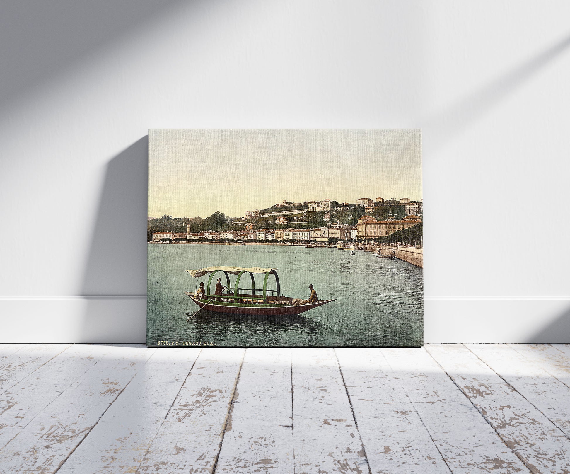 A picture of Lugano, the quay, Tessin, Switzerland, a mockup of the print leaning against a wall