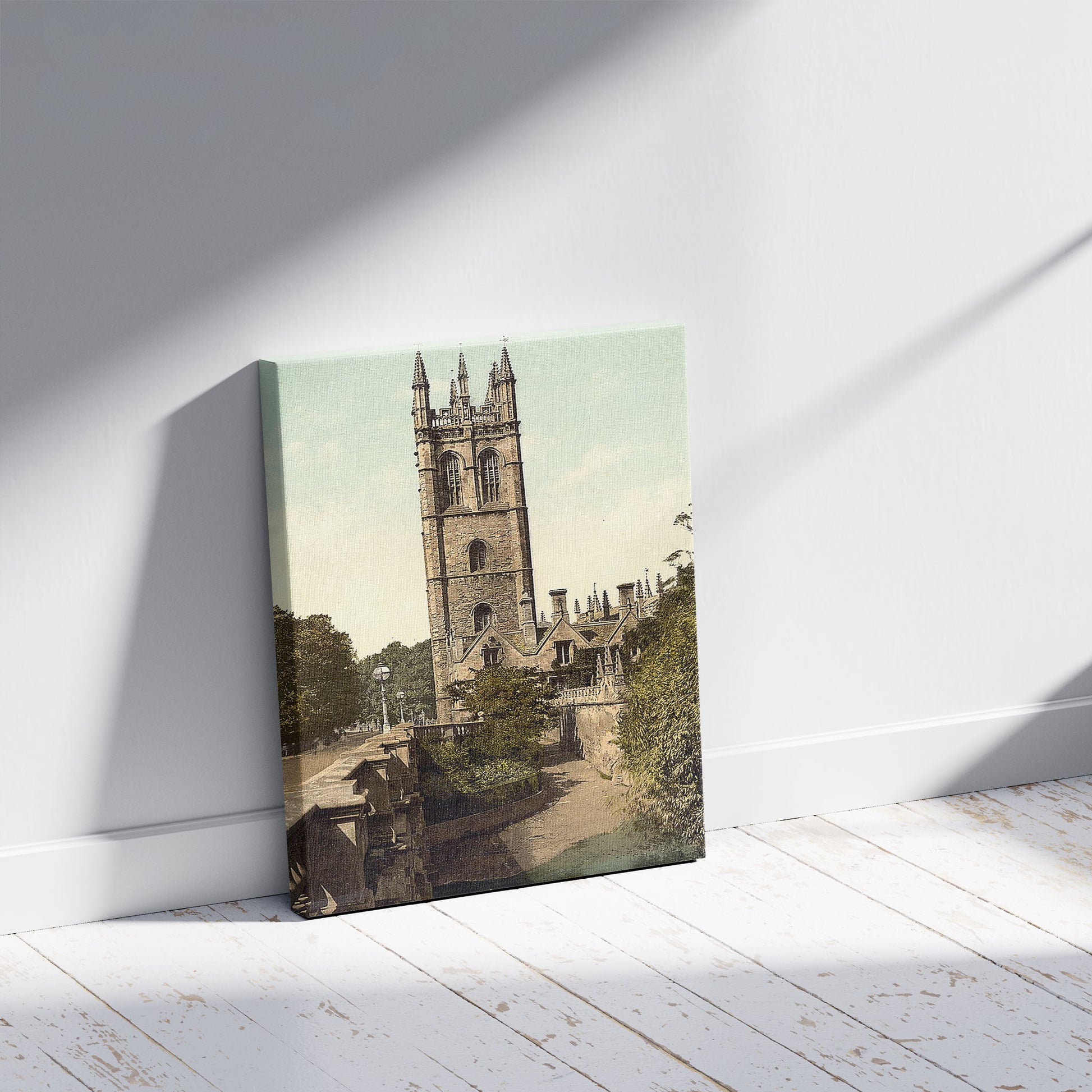 A picture of Magdalen Tower, Oxford, England, a mockup of the print leaning against a wall