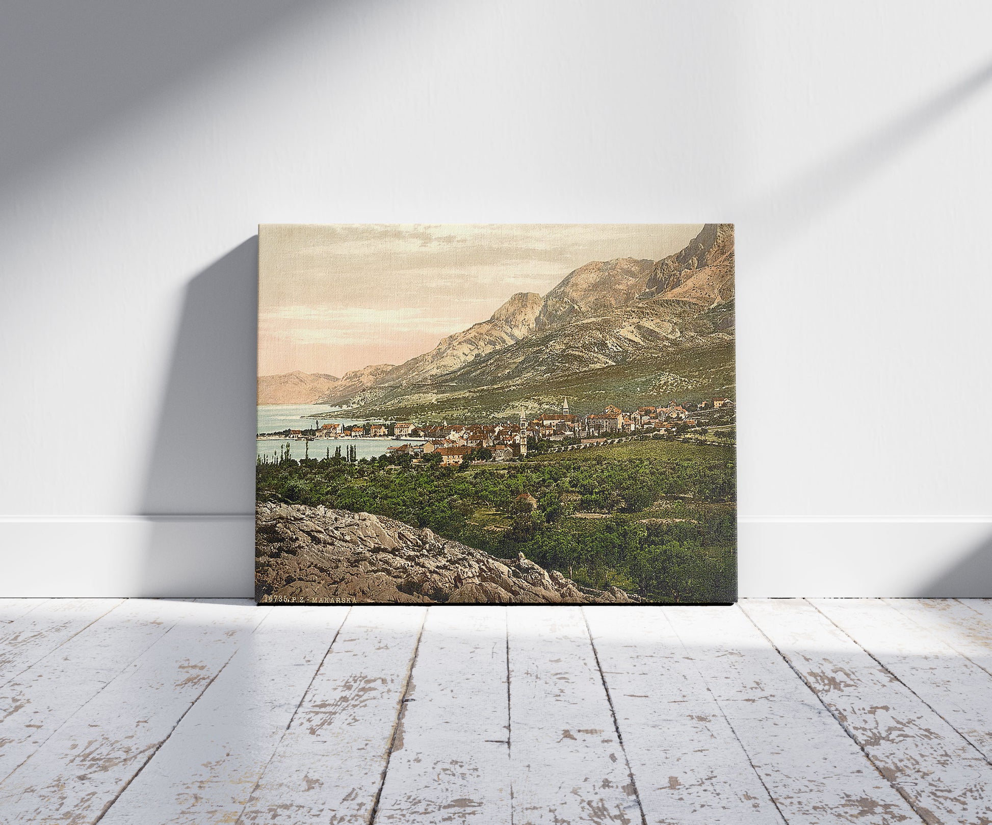 A picture of Makarska, general view, Dalmatia, Austro-Hungary, a mockup of the print leaning against a wall