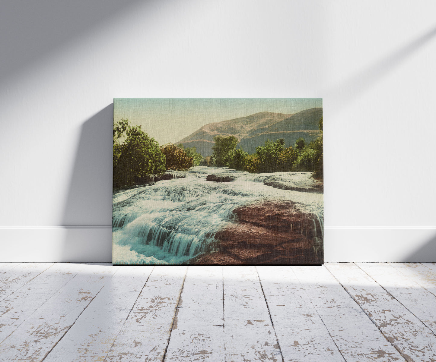 A picture of Mangapapa Falls, Wairoa, a mockup of the print leaning against a wall