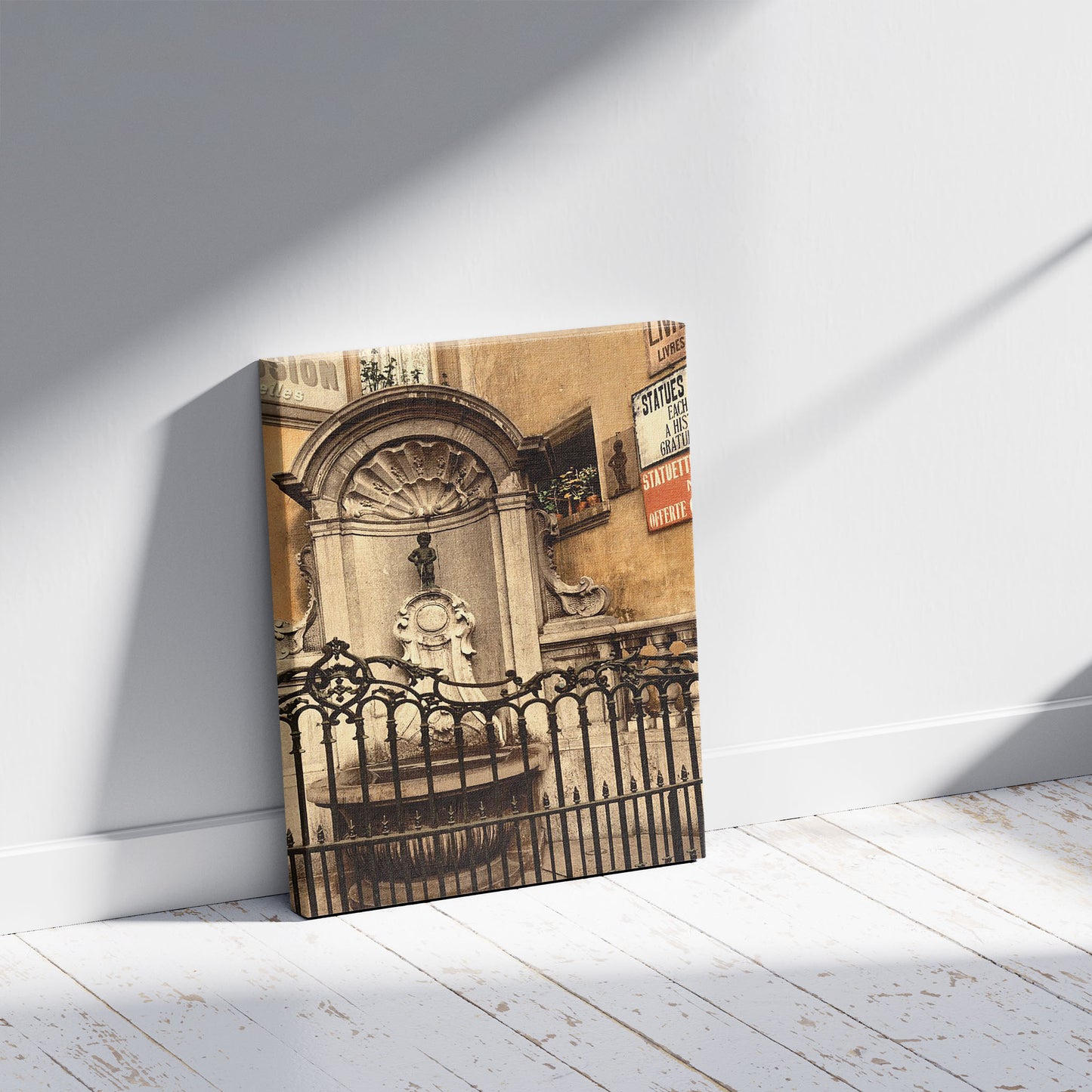 A picture of Manneken Pis, Brussels, Belgium, a mockup of the print leaning against a wall