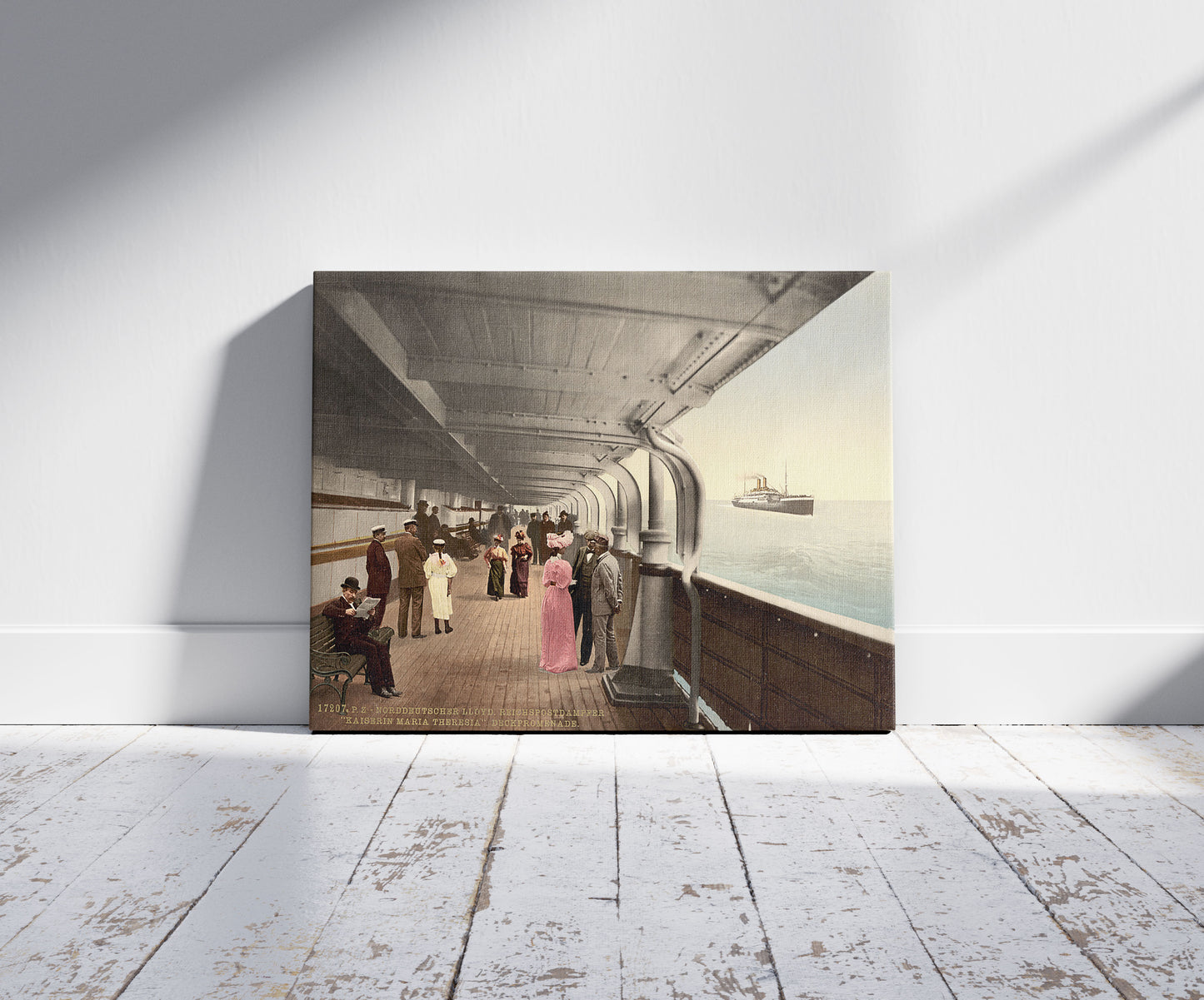 A picture of "Maria Theresia," Promenade Deck, North German Lloyd, Royal Mail Steamers, a mockup of the print leaning against a wall
