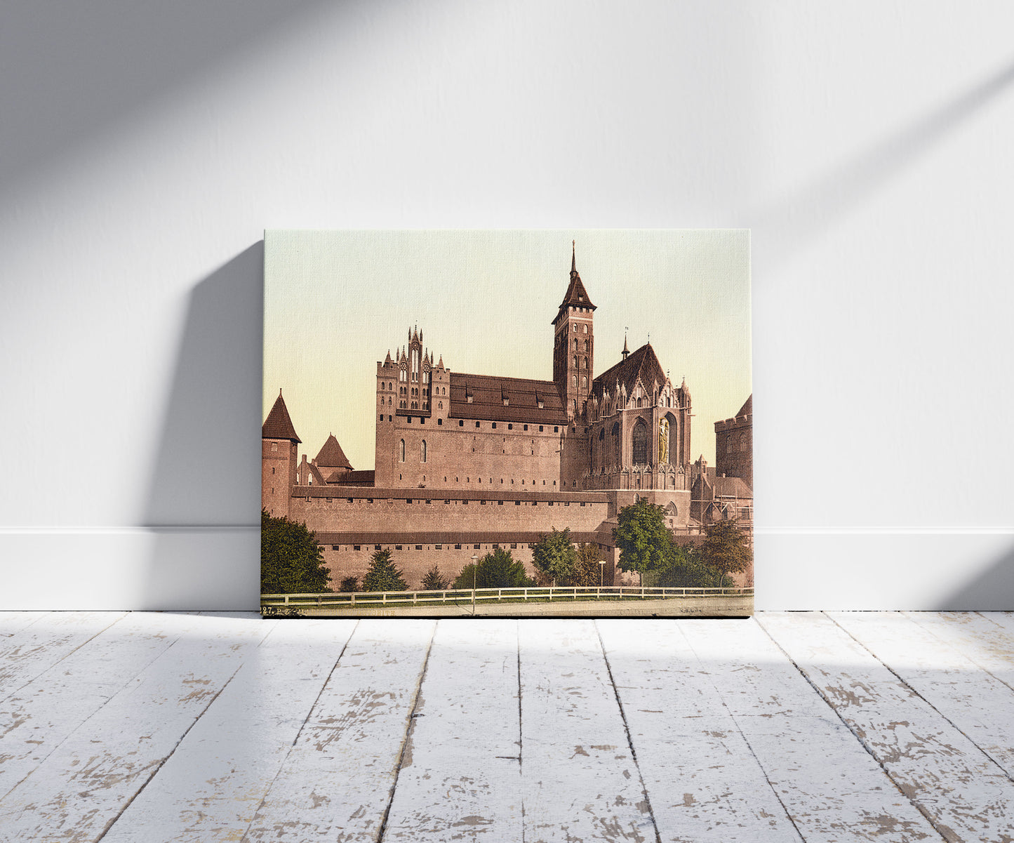 A picture of Marienburg, east side, Prussia, Germany (i.e., Malbork, Poland), a mockup of the print leaning against a wall