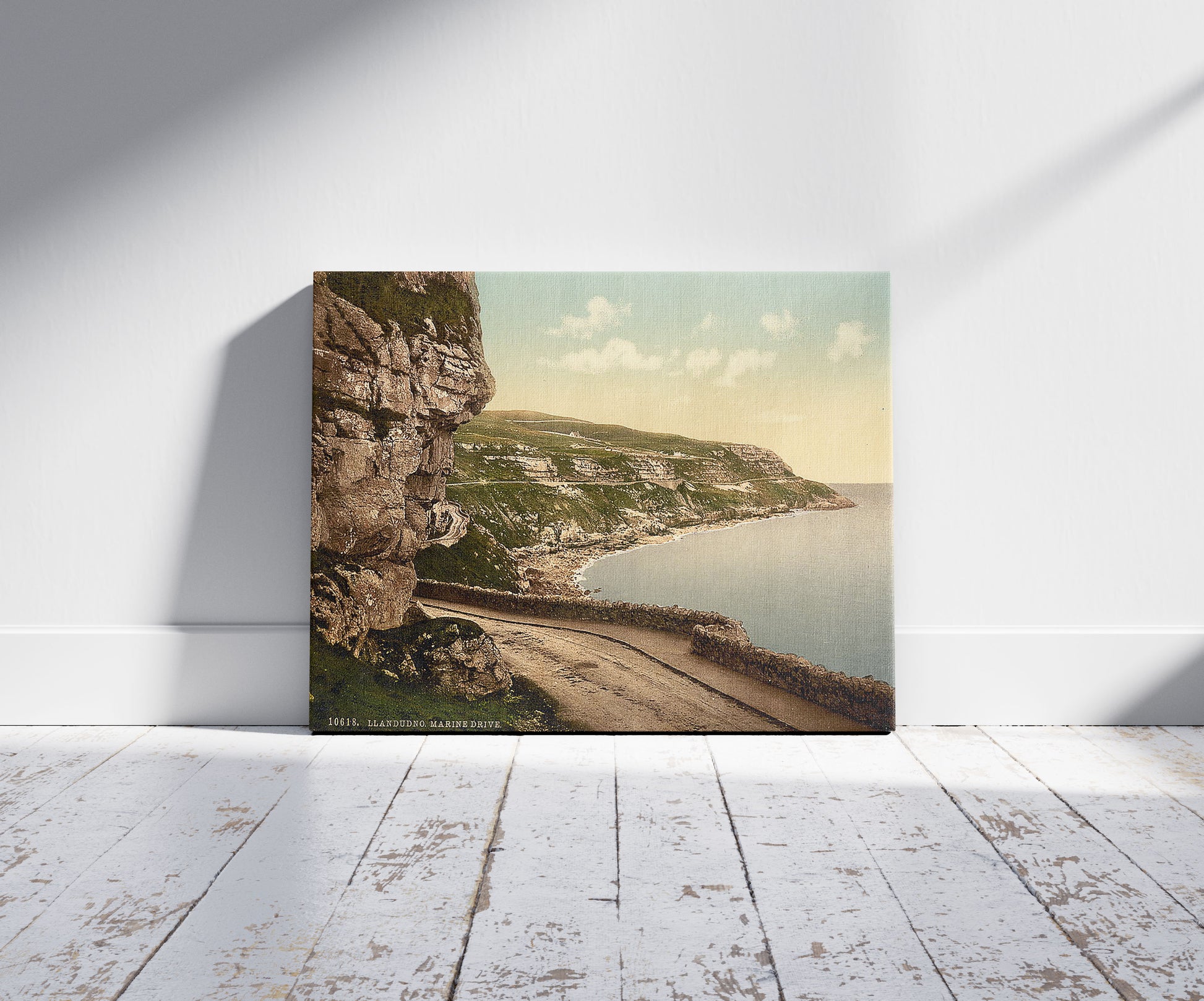 A picture of Marine Drive, Llandudno, Wales, a mockup of the print leaning against a wall