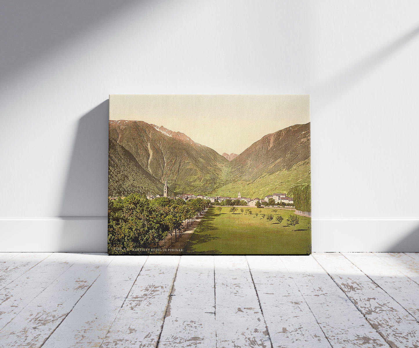A picture of Martigny and Forclay Pass, Valais, Alps of, Switzerland, a mockup of the print leaning against a wall