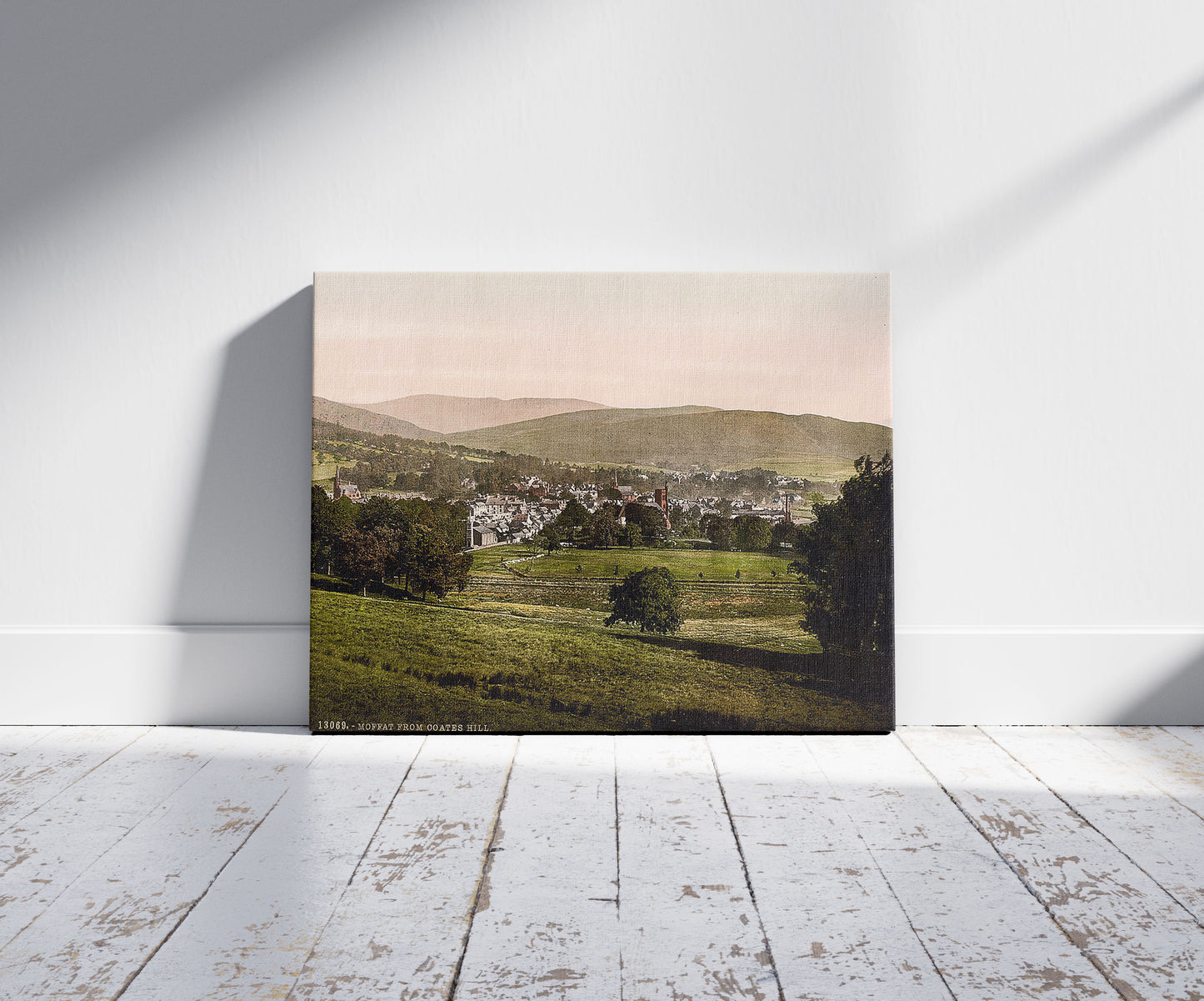 A picture of Moffat from Coates Hill, Scotland, a mockup of the print leaning against a wall