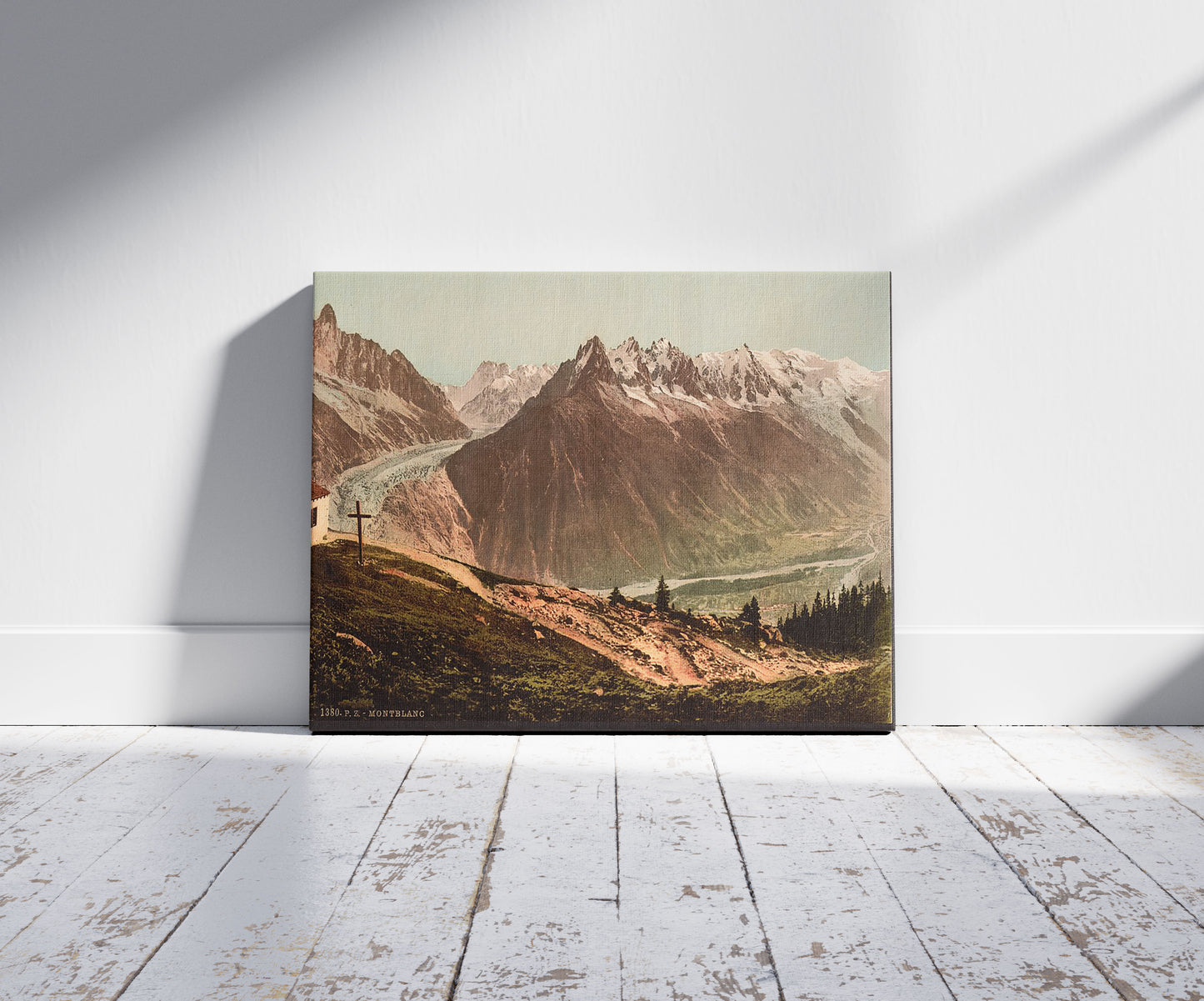 A picture of Mont Blanc, the chain from La Flégère, Chamonix Valley, France, a mockup of the print leaning against a wall