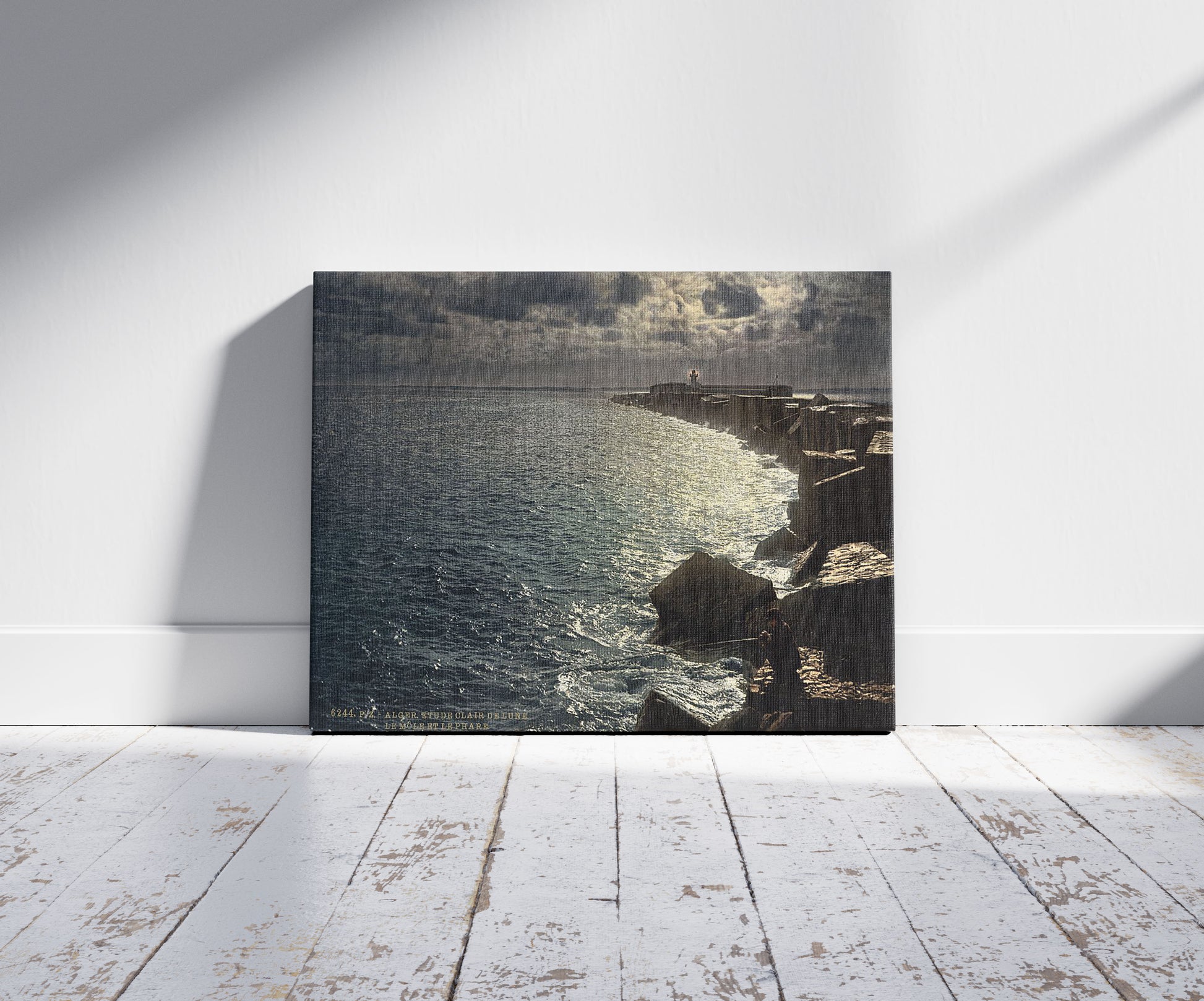 A picture of Moonlight view, with lighthouse, Algiers, Algeria, a mockup of the print leaning against a wall
