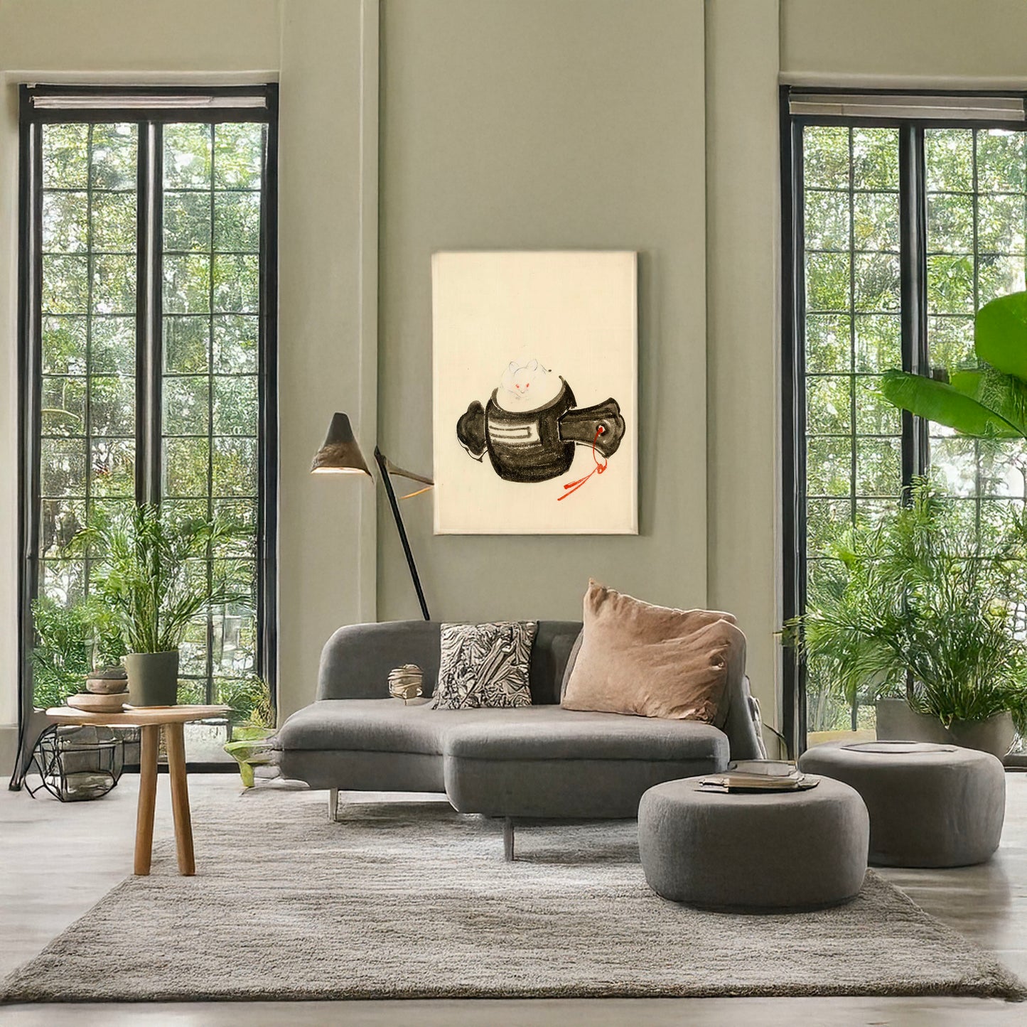 A picture of Mouse, facing front, sitting on a mallet with red ribbon through a hole in the handle, a mockup of the print leaning against a wall