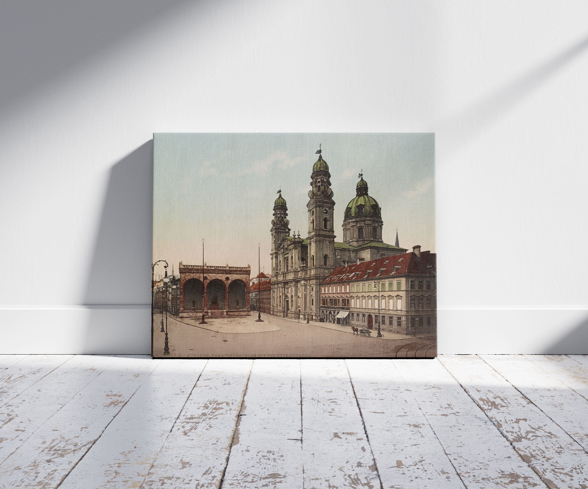 A picture of München. Theatinerkirche mit Feldherrnhalle, a mockup of the print leaning against a wall