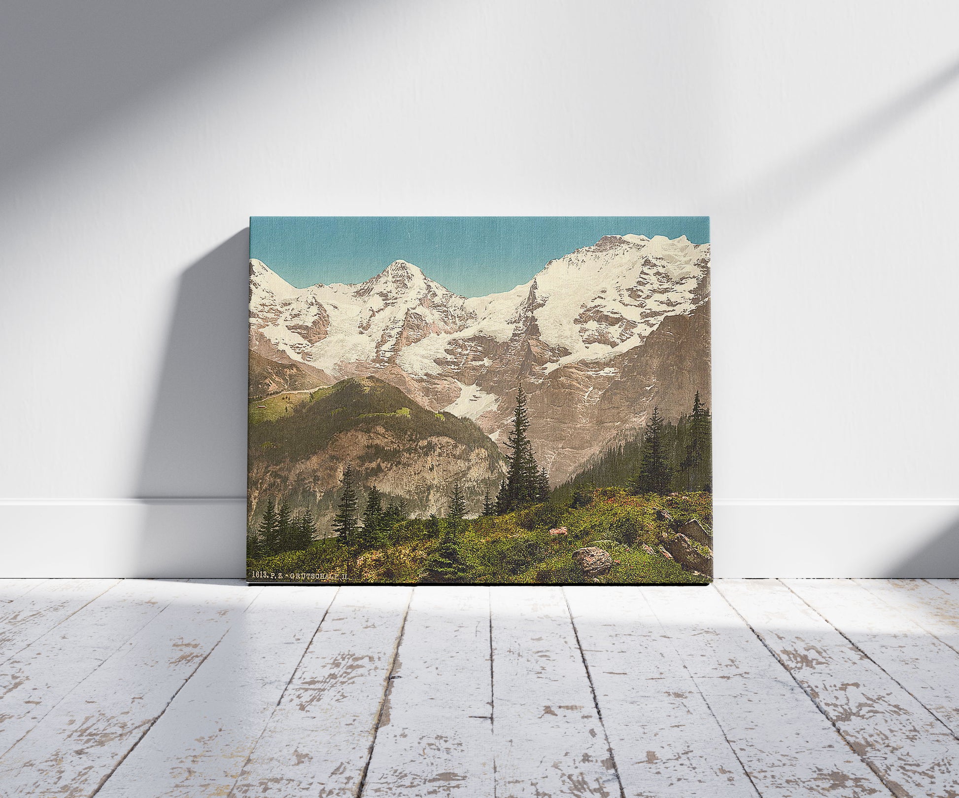 A picture of Murren, Grutschalp, II, Eiger, Monch and Jungfrau, Bernese Oberland, Switzerland, a mockup of the print leaning against a wall