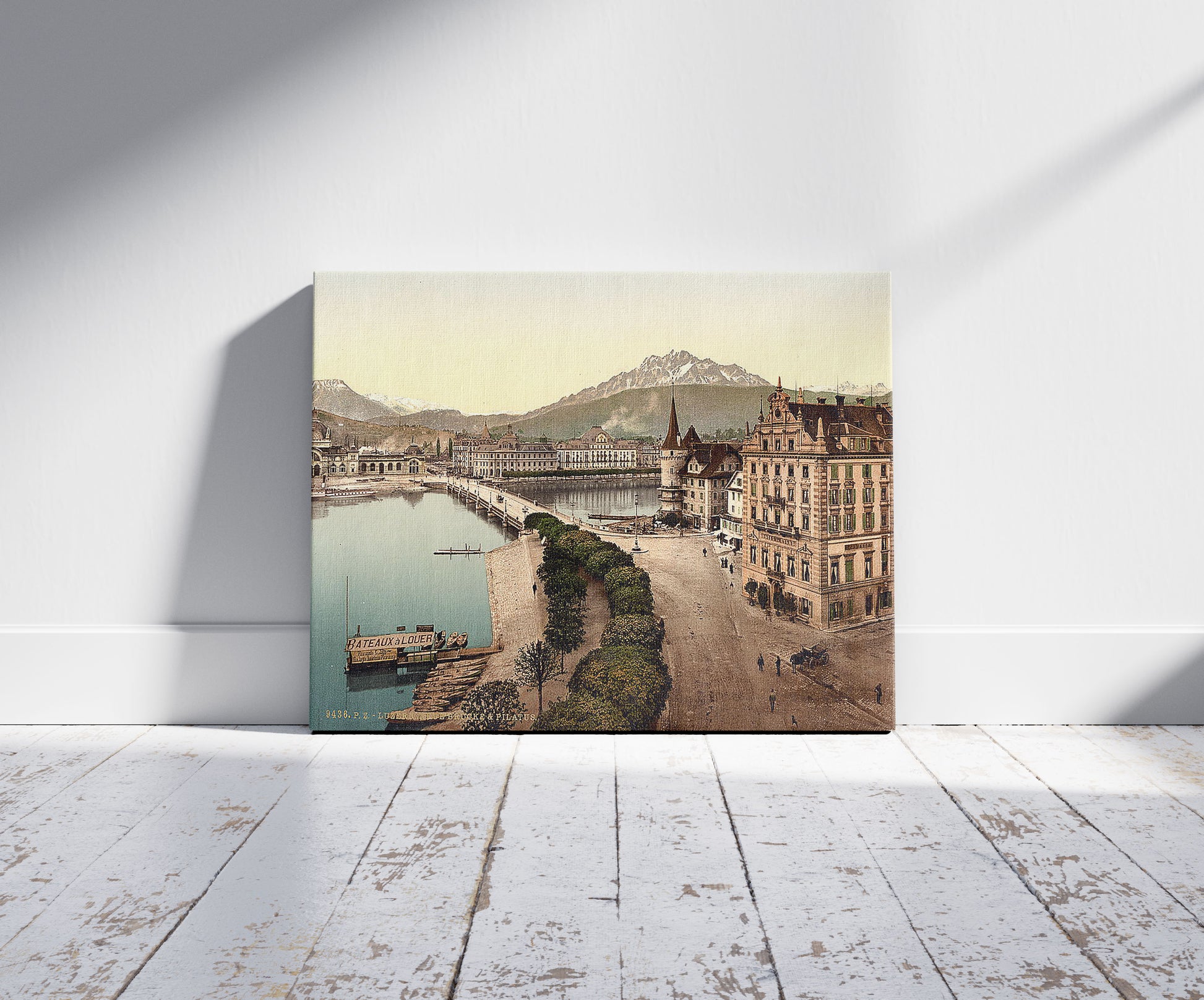 A picture of New Bridge and Pilatus, Lucerne, Switzerland, a mockup of the print leaning against a wall