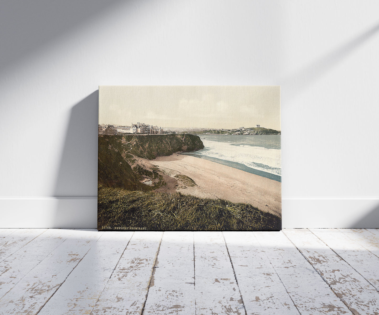 A picture of Newquay, from East, Cornwall, England, a mockup of the print leaning against a wall