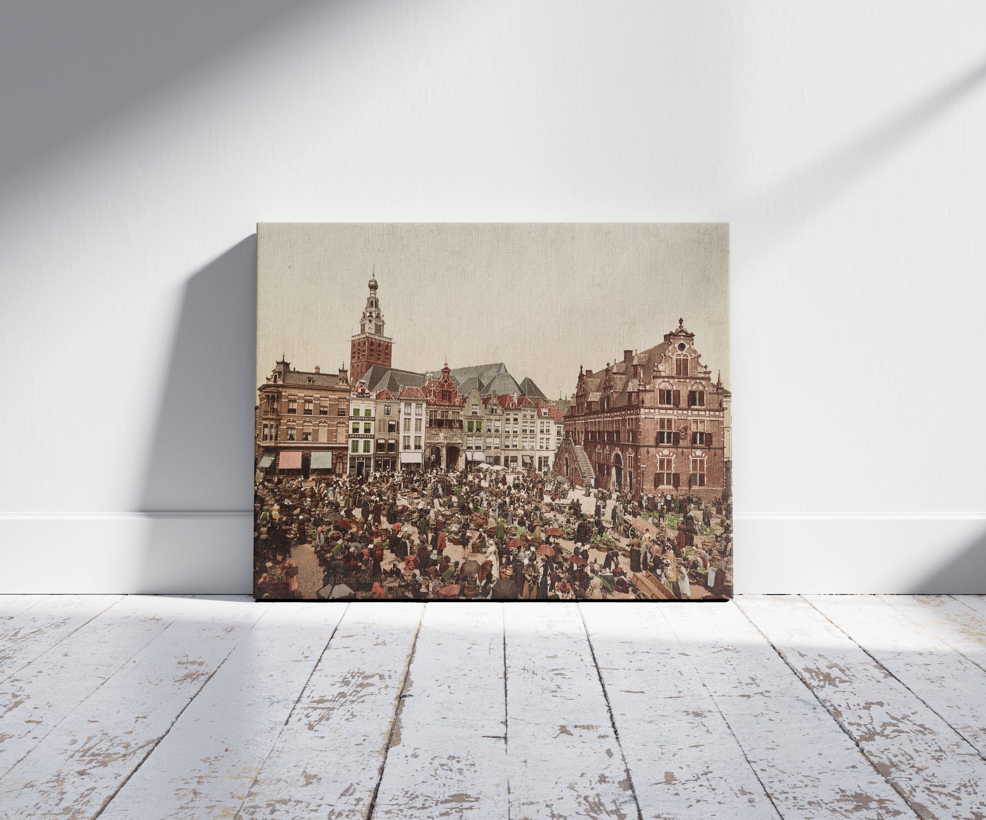 A picture of Nijmegen groote markt, a mockup of the print leaning against a wall