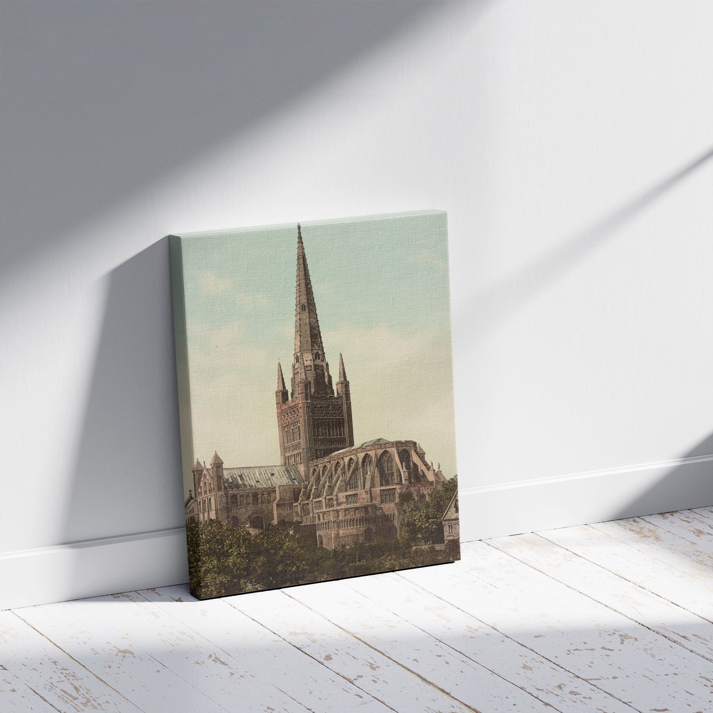 A picture of Norwich Cathedral, a mockup of the print leaning against a wall