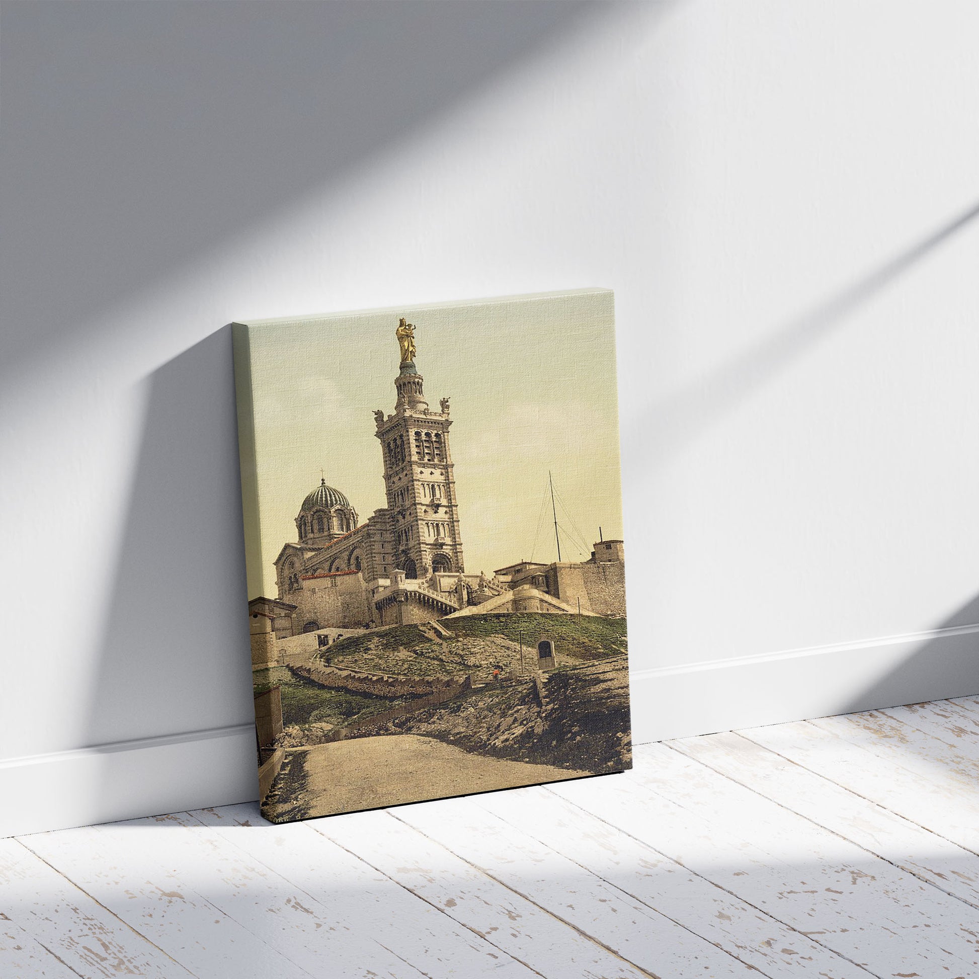 A picture of Notre Dame de la Garde II, Marseilles, France, a mockup of the print leaning against a wall